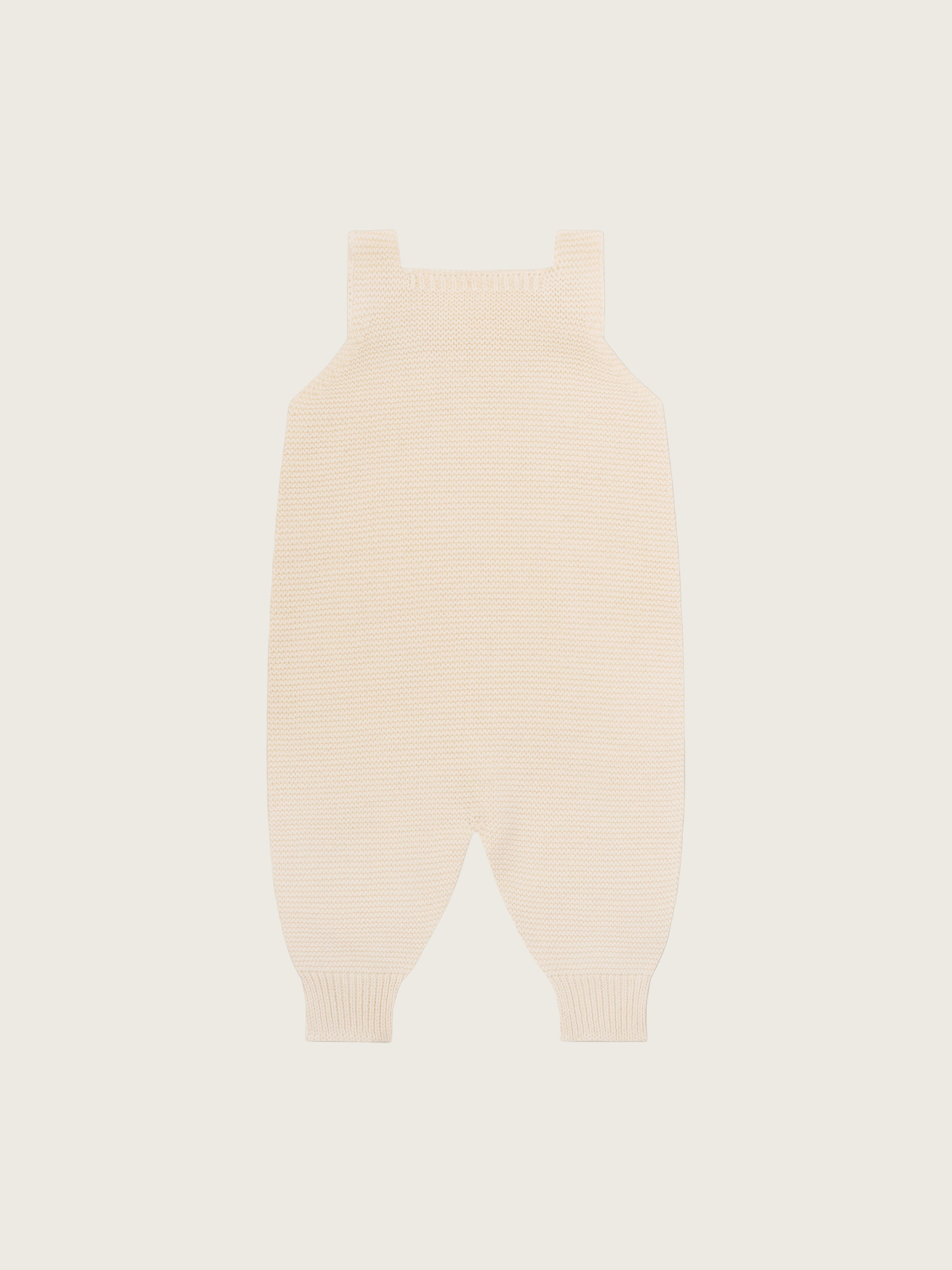 baby and toddler undyed cotton knitted salopette in cream with wooden buttons