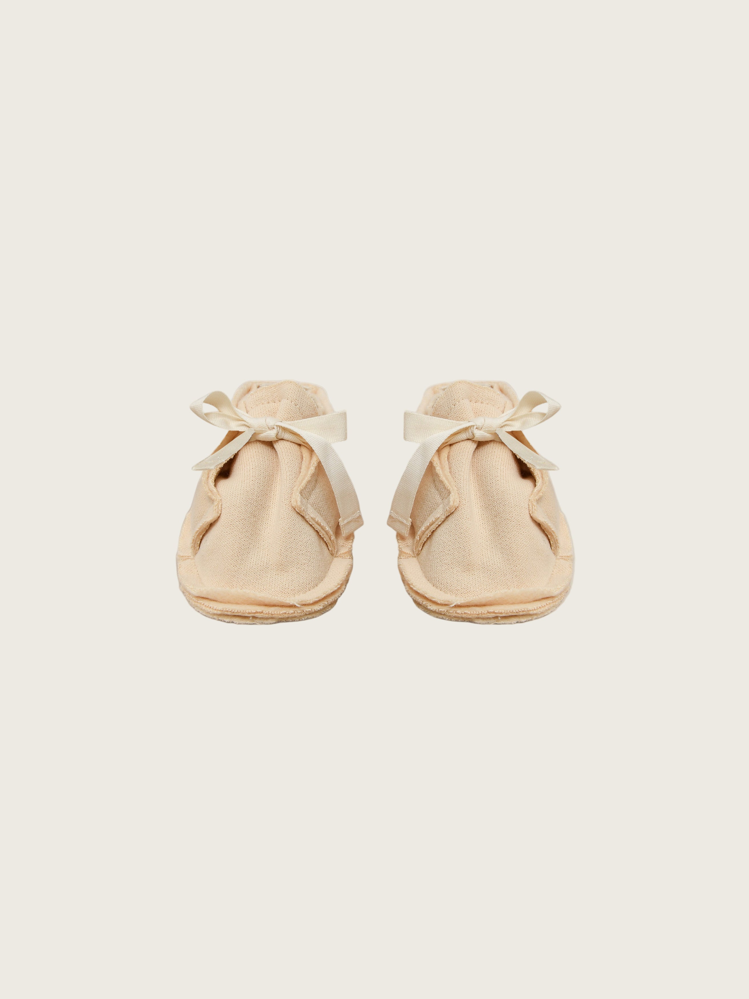 baby and toddler terry cotton booties in cream with white bow