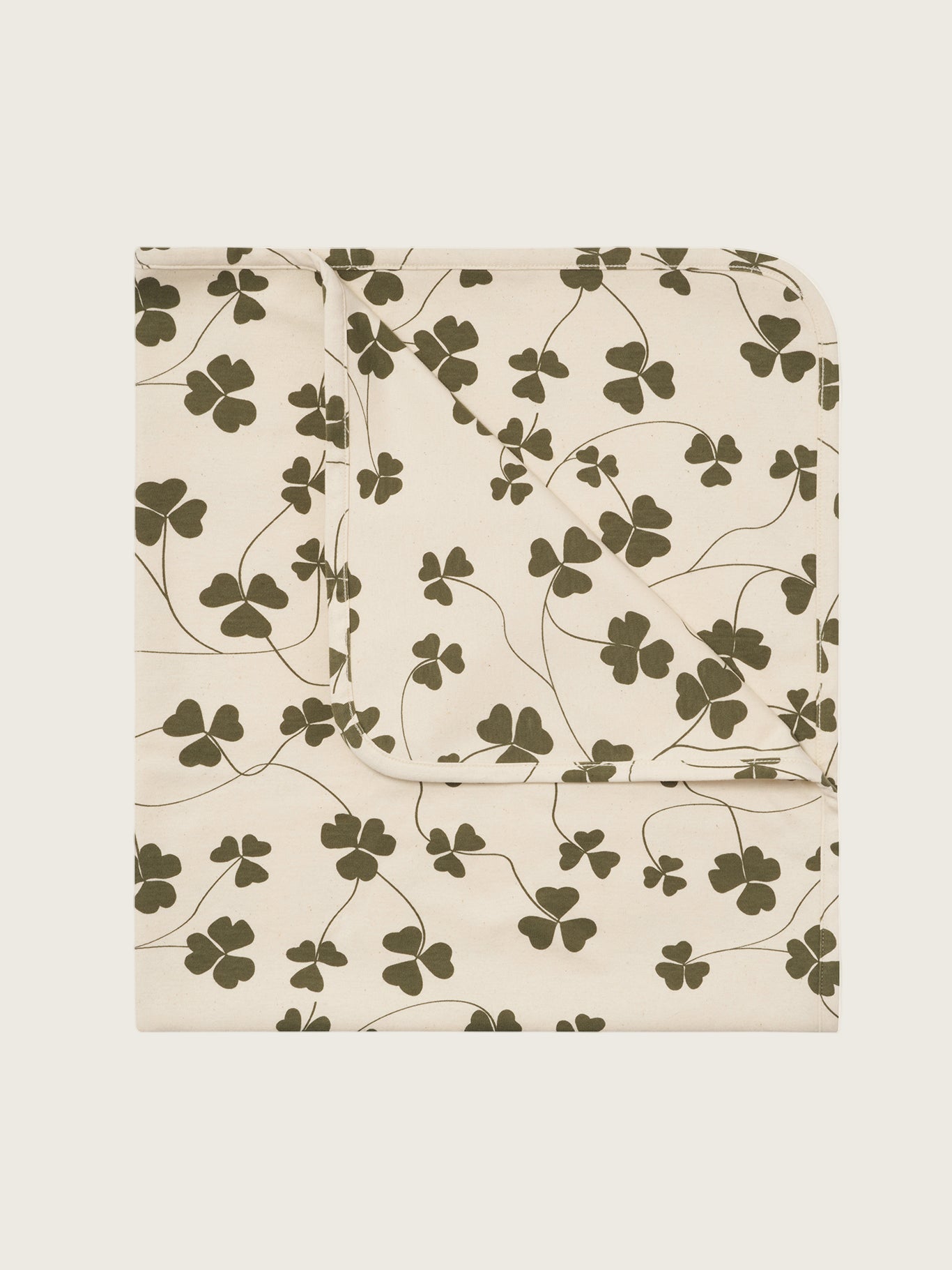 baby and toddler cream undyed cotton reversible blanket with green clover leaf print