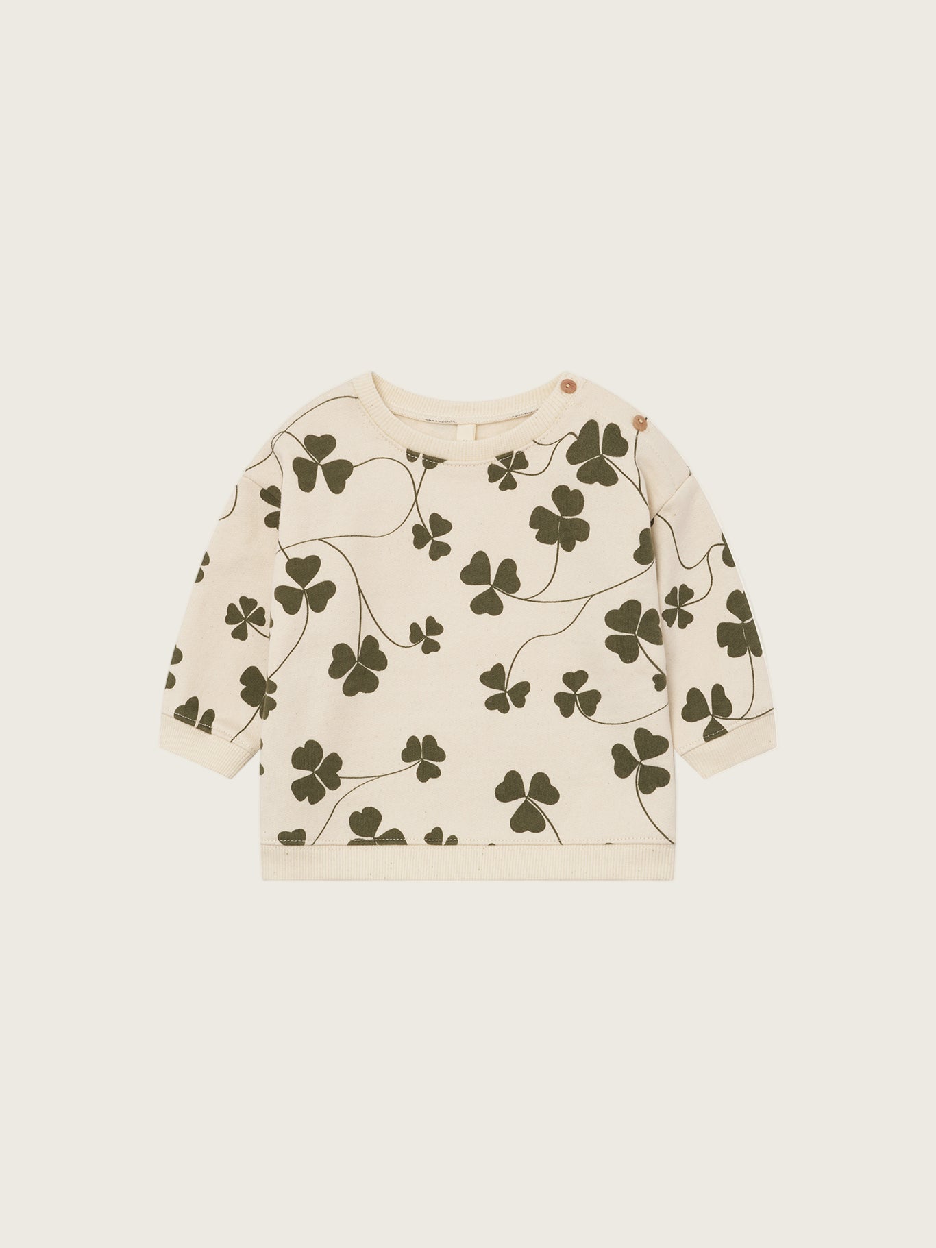 baby cream undyed cotton sweatshirt with green clover print and two shoulder buttons