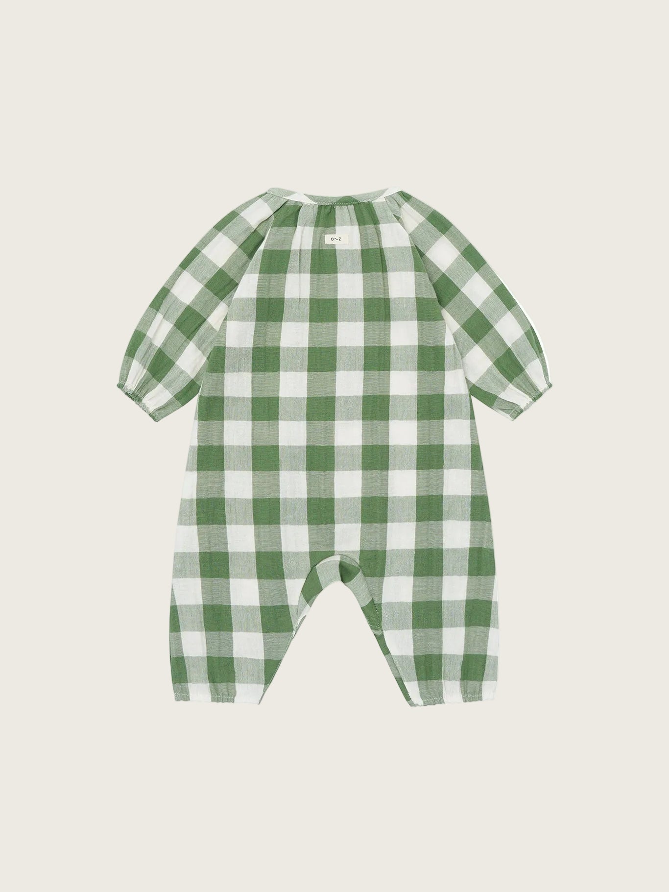 Green and white checkered baby romper on a white background