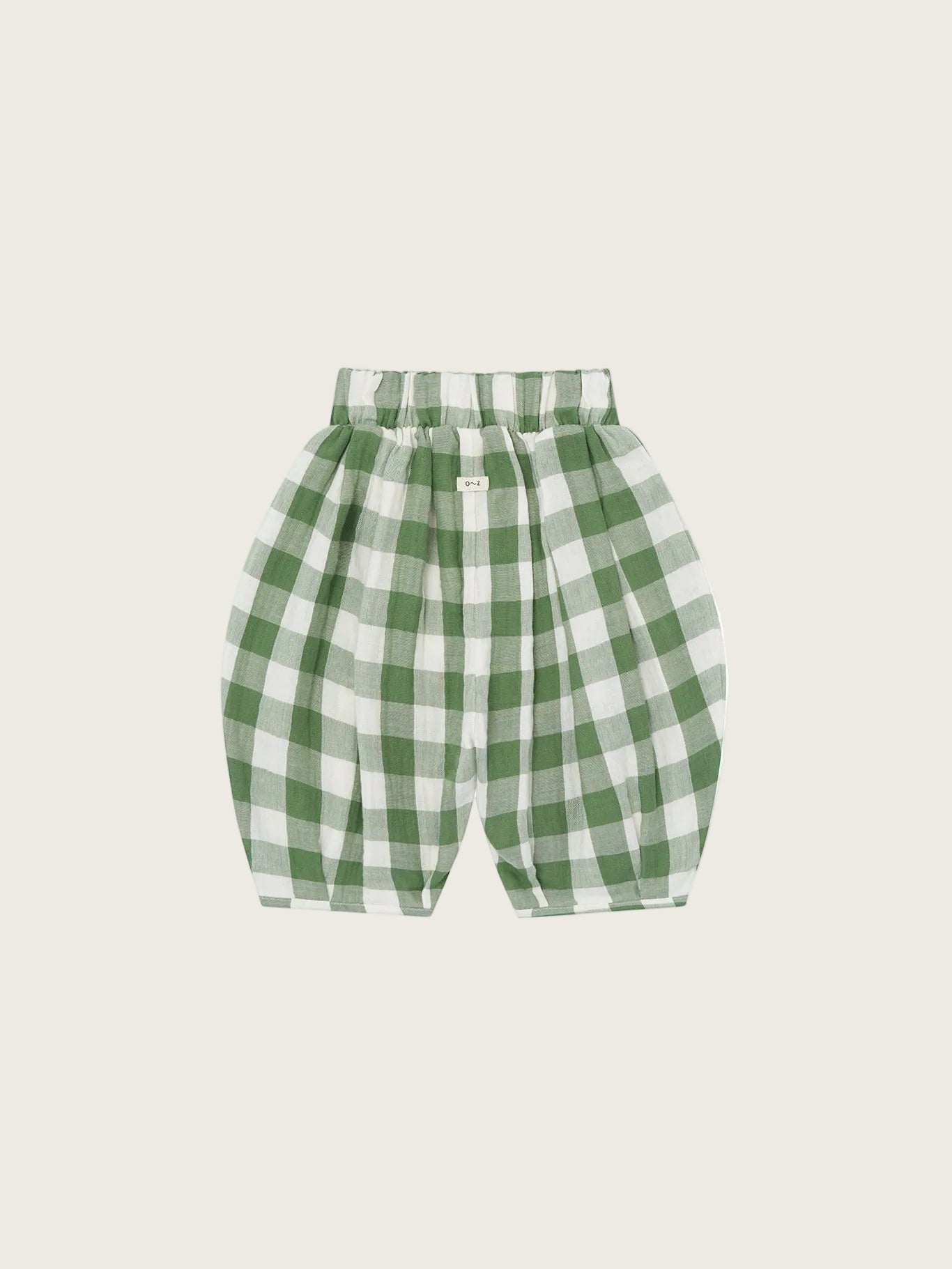 Green and white checkered pants on a white background
