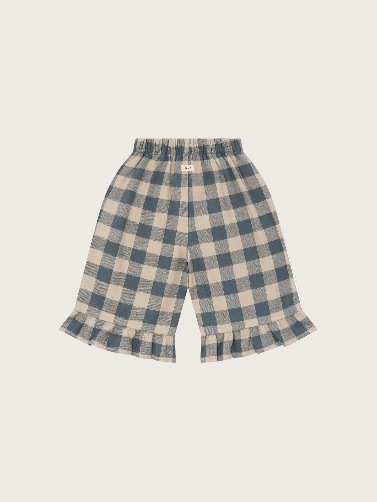 A pair of toddler culottes featuring a blue and beige gingham plaid pattern with a ruffled hem, displayed against a solid white background.