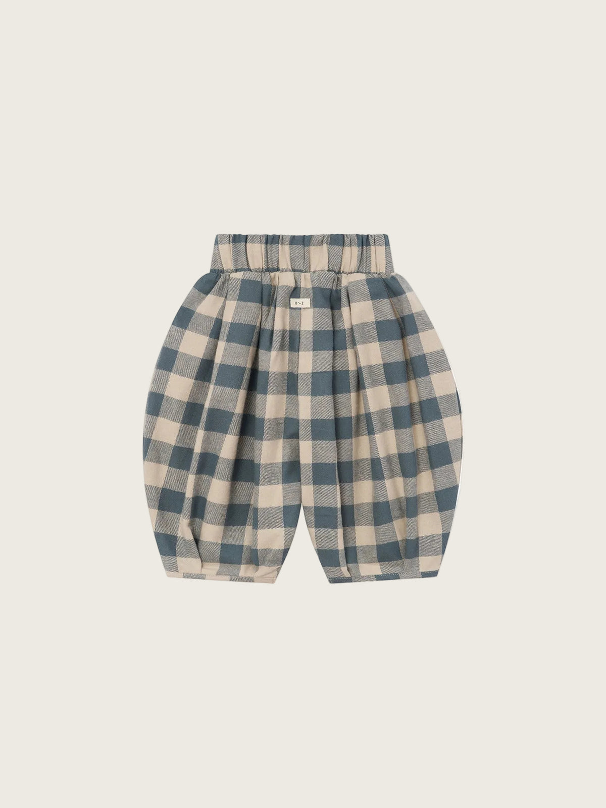 A pair of children's pleated pants in a muted blue and beige gingham check pattern, shown flat against a solid white background.