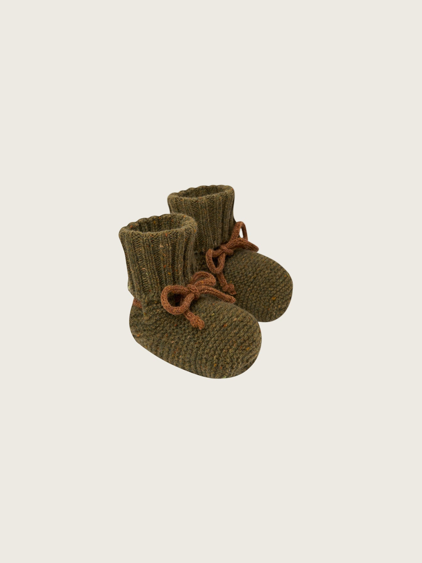baby and toddler wool booties in forest green with ribbed cuffs and brown ribbons