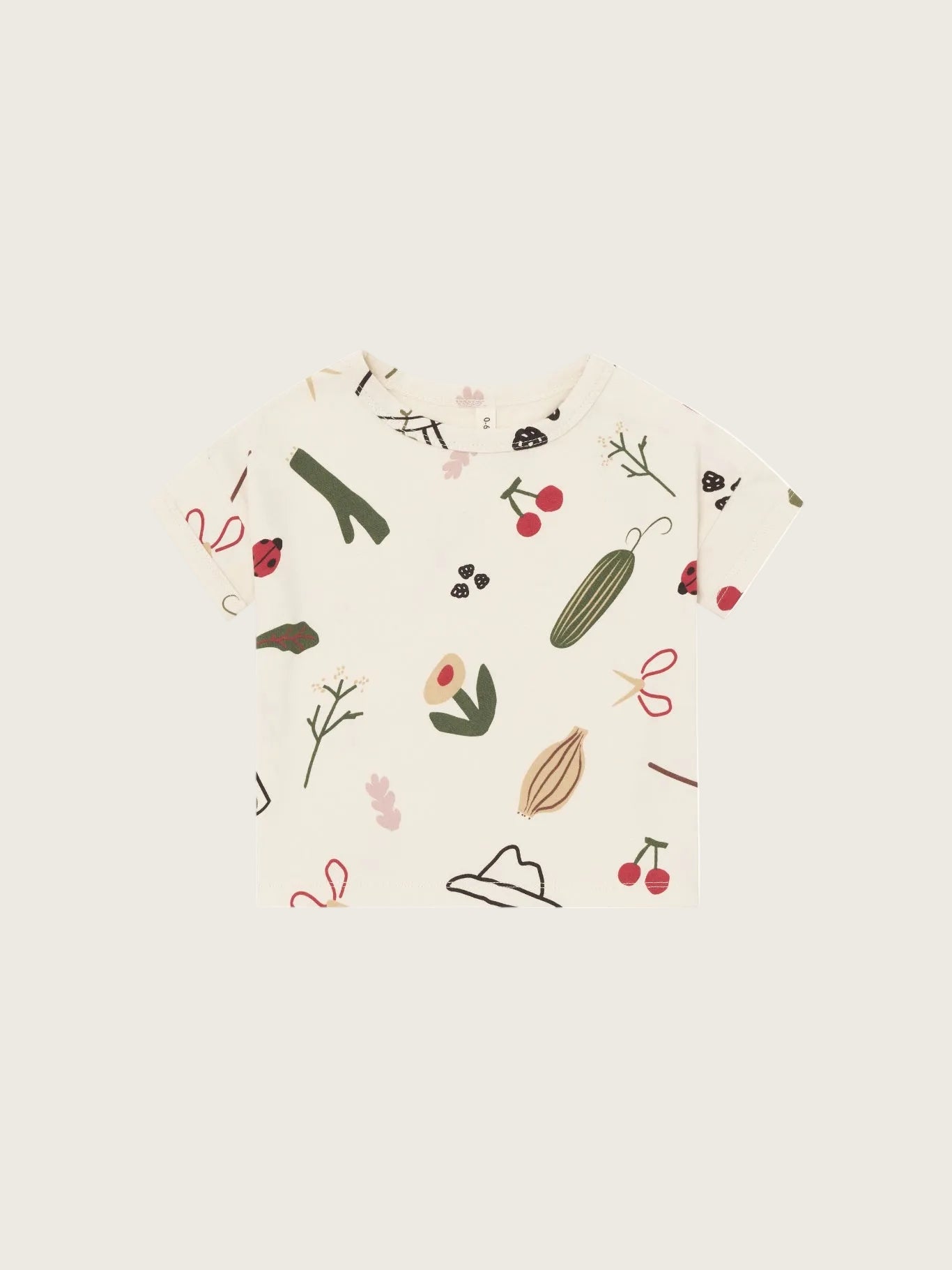 Beige t-shirt with nature-themed illustrations on a white background