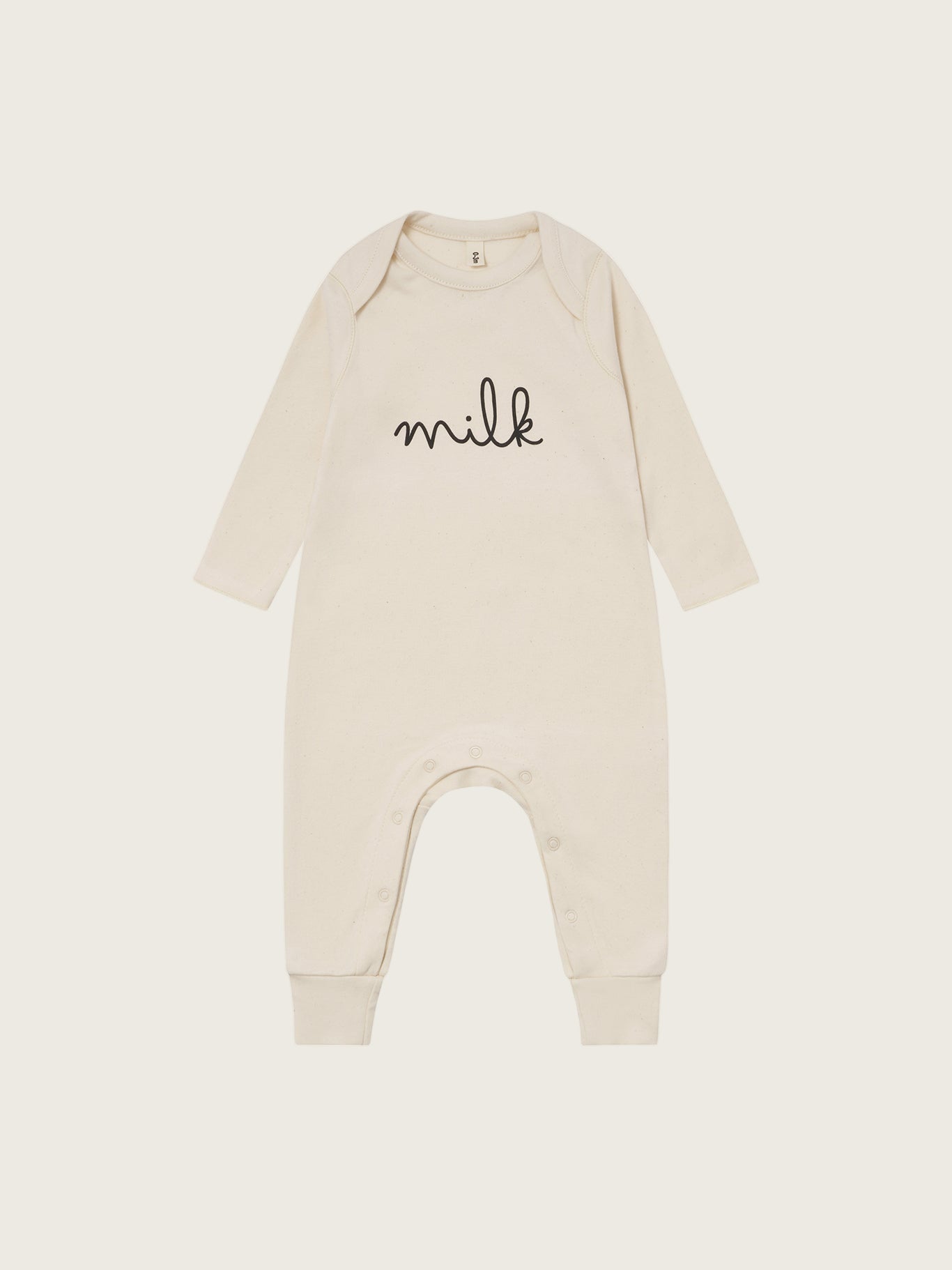 baby cream undyed cotton playsuit with milk text, crotch poppers, ribbed ankle cuffs, and back print