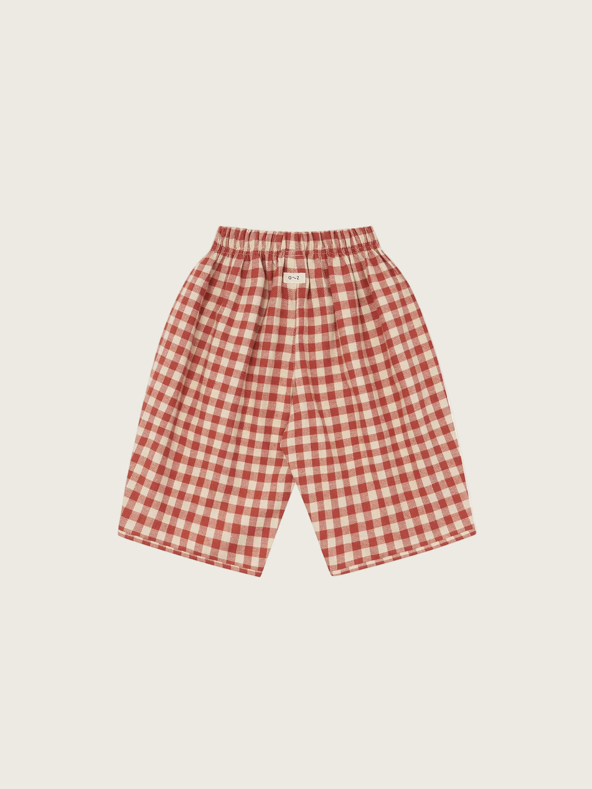 Red and white gingham check shorts with an elastic waistband, shown flat against a solid white background.