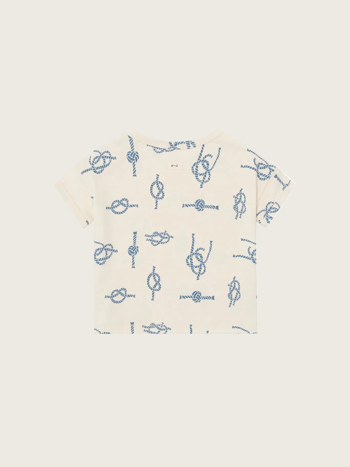 Beige t-shirt with blue knot pattern on a white background