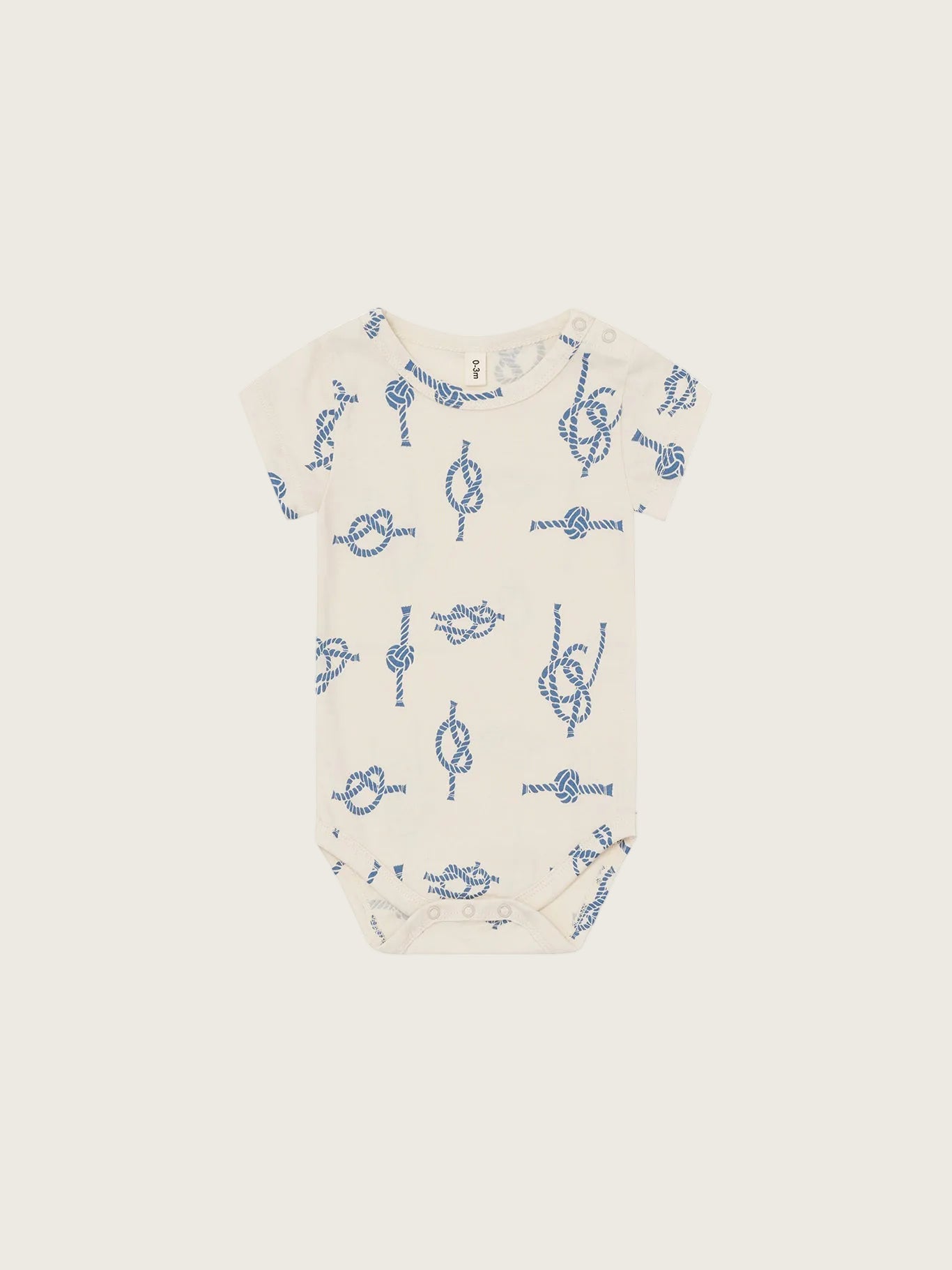 Baby onesie with blue knot pattern on a white background