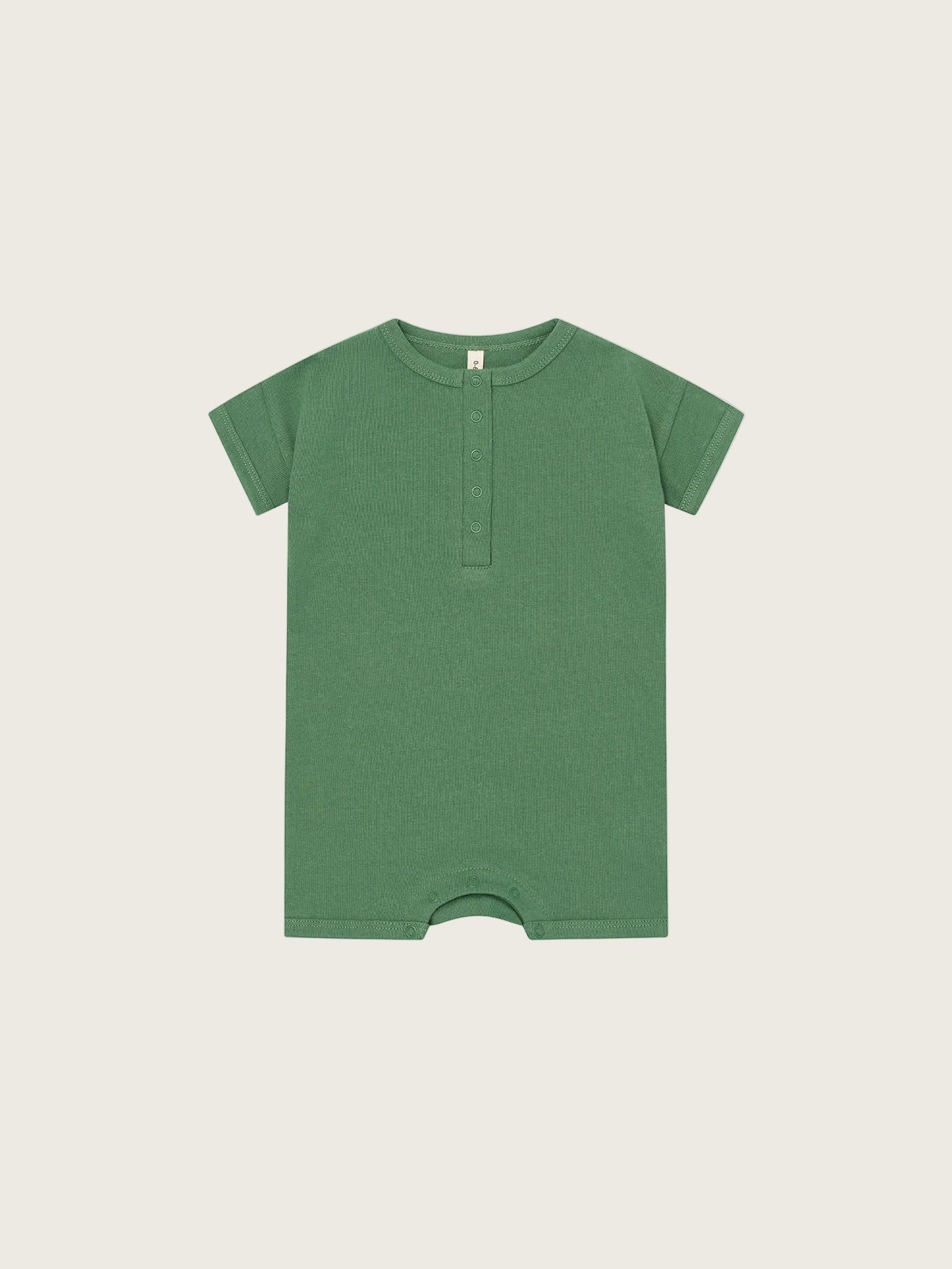 Green baby romper on a white background