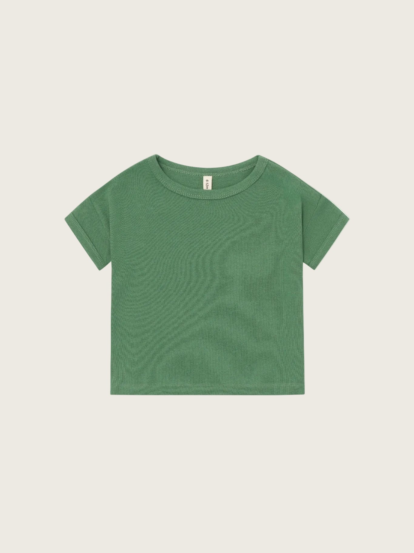 Green t-shirt on a light gray background