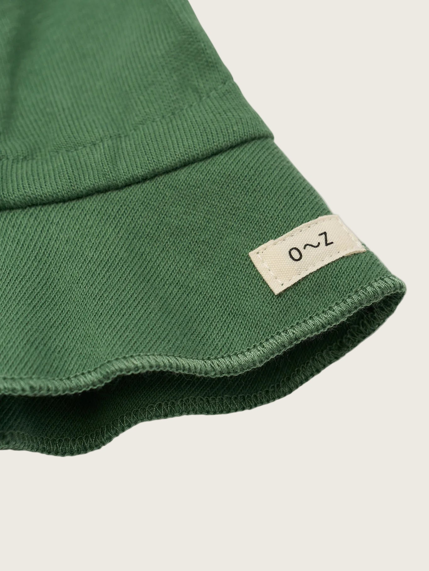Green fabric with a label on a white background