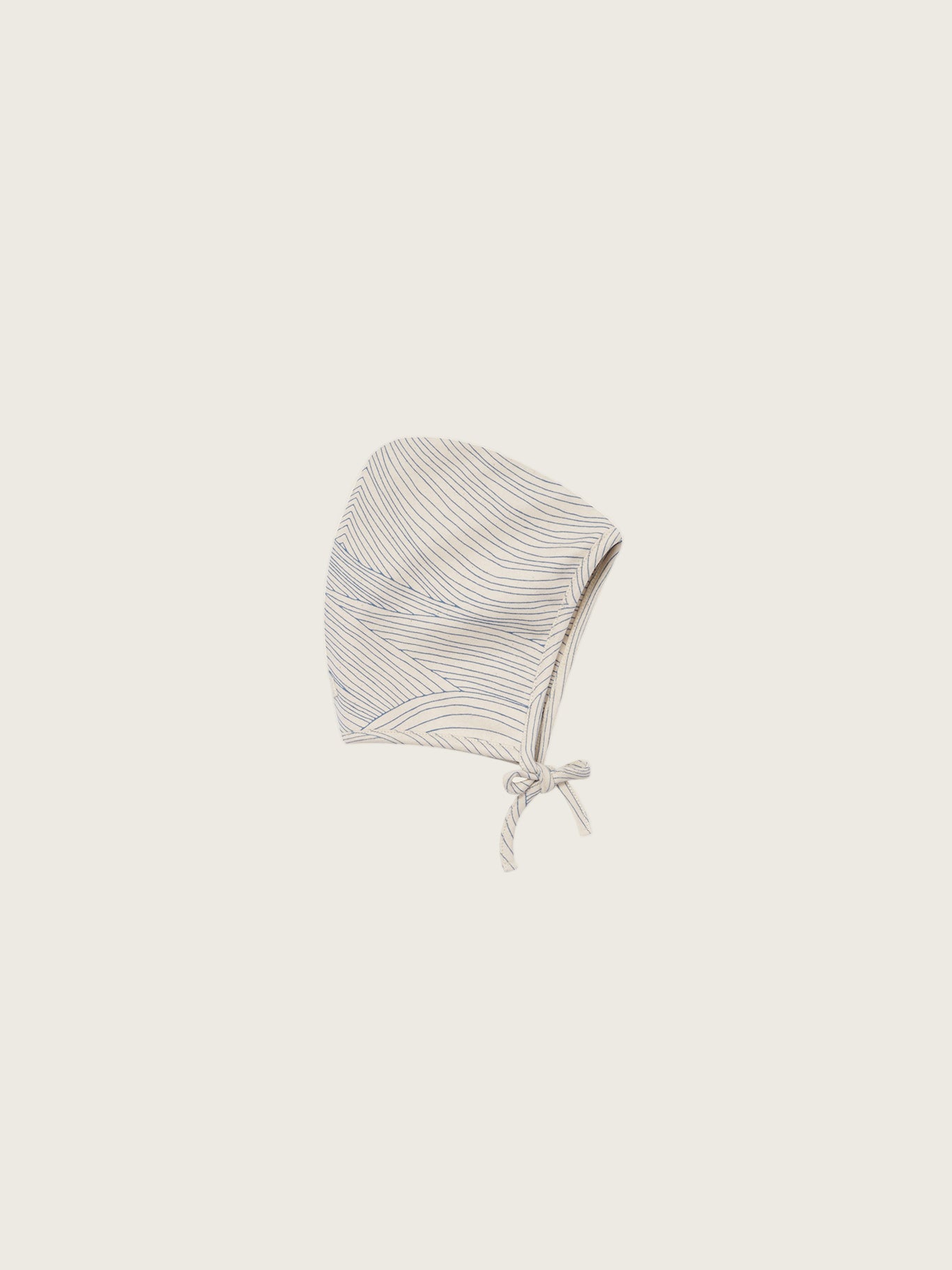baby cream undyed cotton pixie bonnet with blue line-drawn ocean waves, and chin tie
