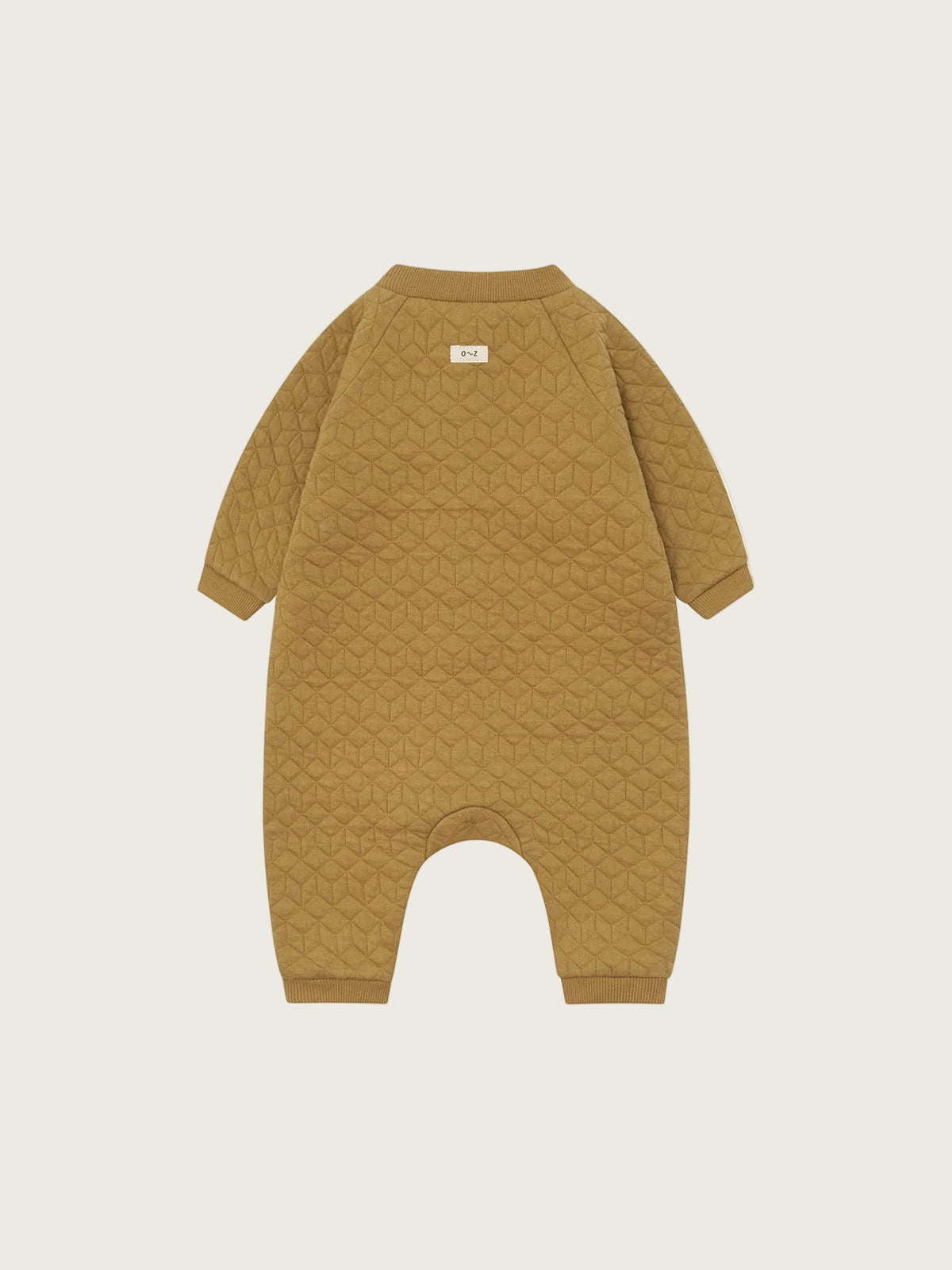 A mustard yellow quilted baby jumpsuit with long sleeves and footless legs, shown flat against a solid white background.
