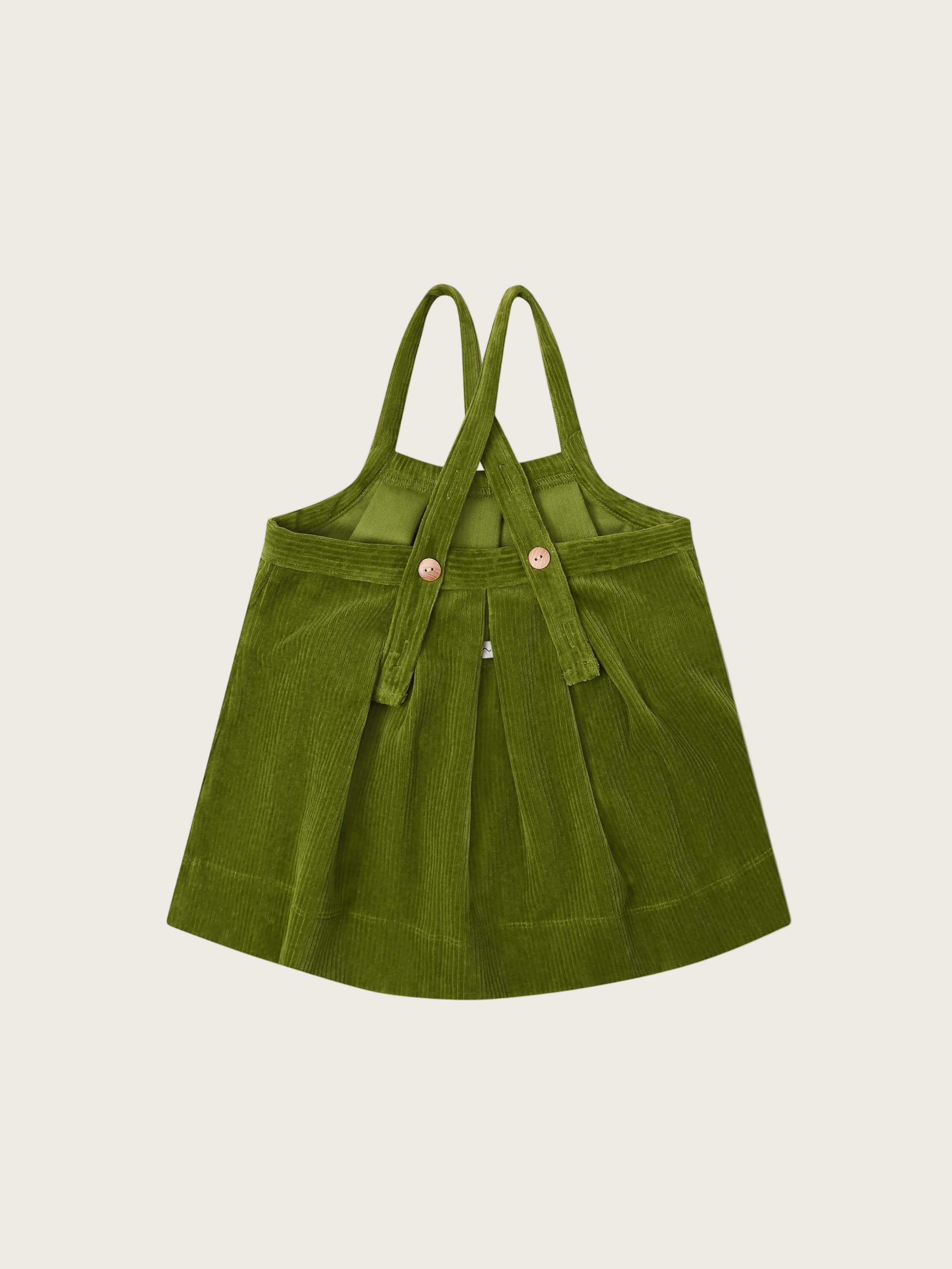 toddler corduroy pinafore skirt in pea pod green with cross-back straps that are adjustable with buttons