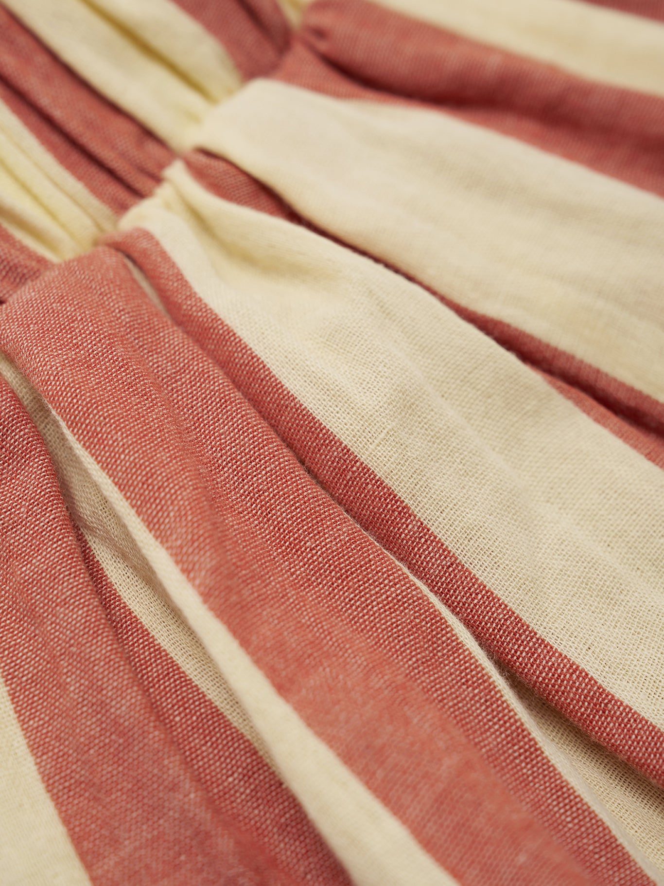 Close-up of striped fabric with red and beige colors
