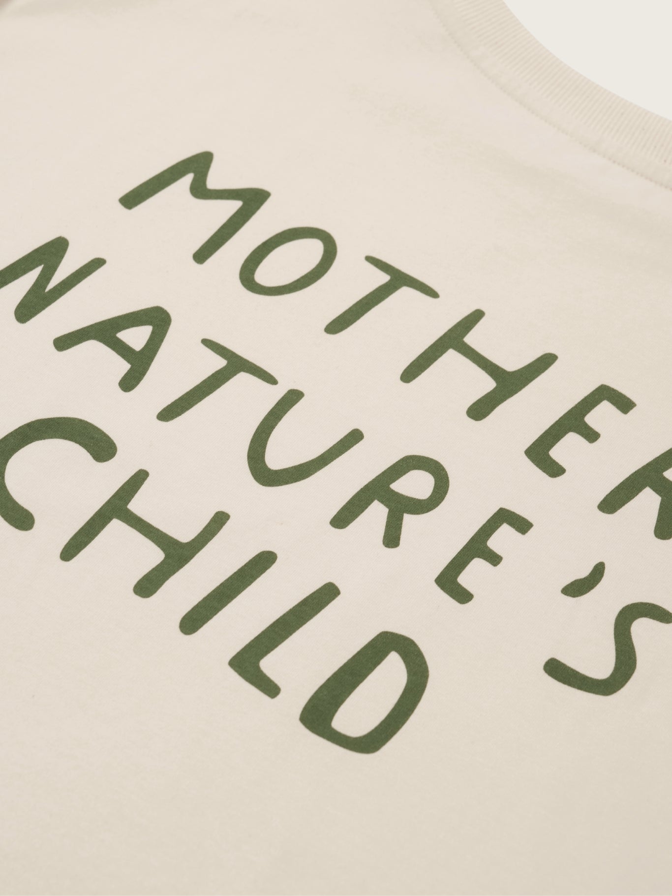 Text 'MOTHER NATURE'S CHILD' printed on a beige background