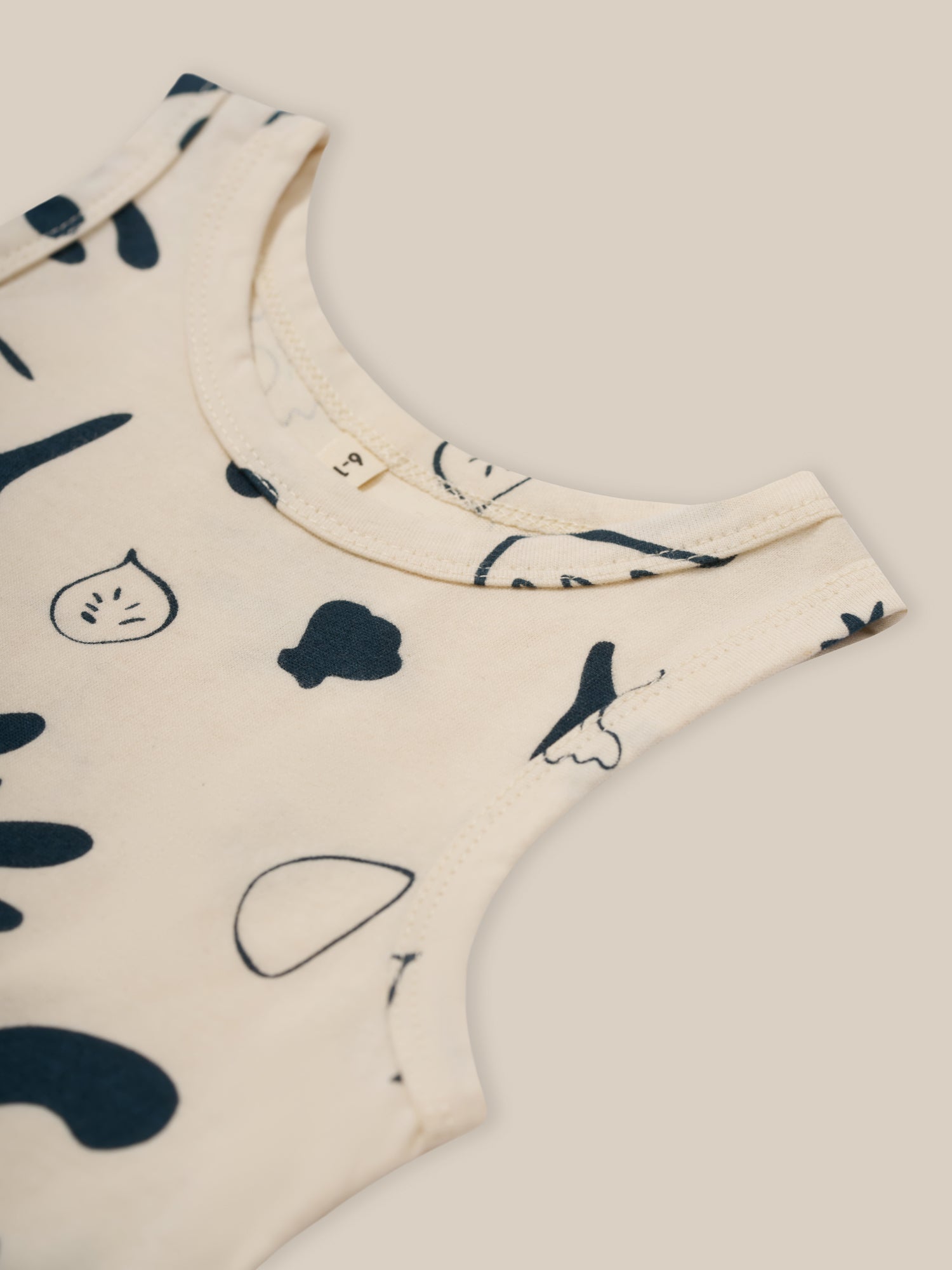 baby and toddler white capri summer vest in undyed cotton with navy ocean print