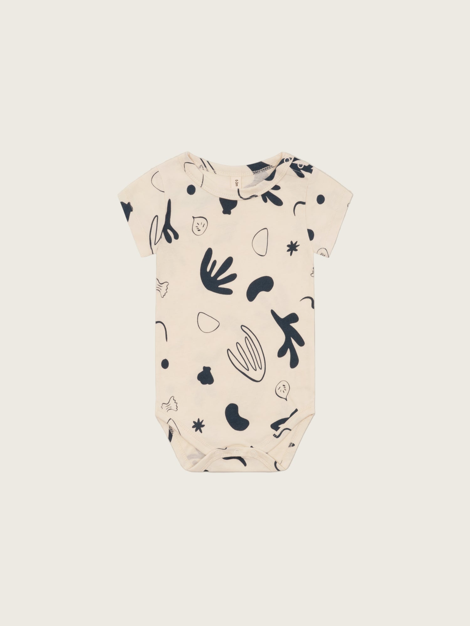 baby undyed cotton short sleeved capri bodysuit in white with ocean print, shoulder & crotch poppers