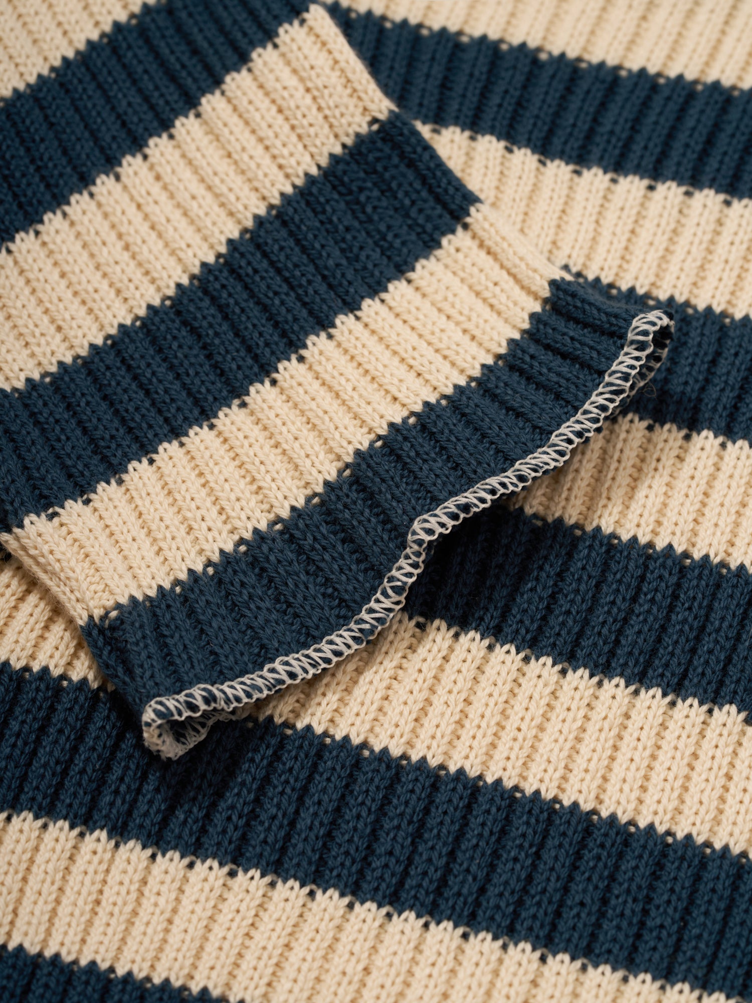 close up of baby & toddler sailor navy striped rib knitted sweater with overlocked hems