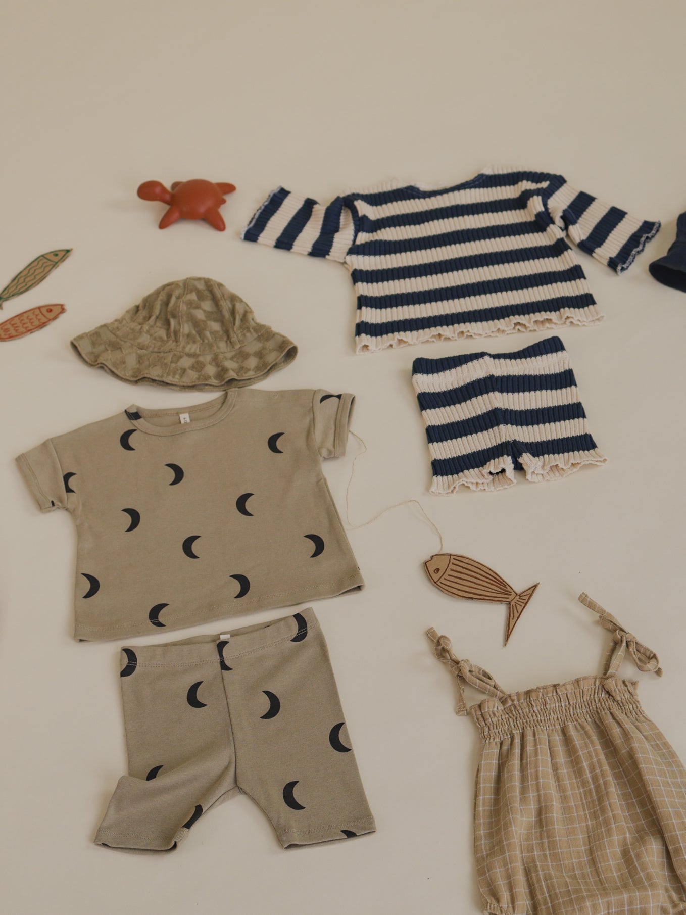 outfit flatlay matching toddler rib knitted shorts & sweater with navy sailor stripes