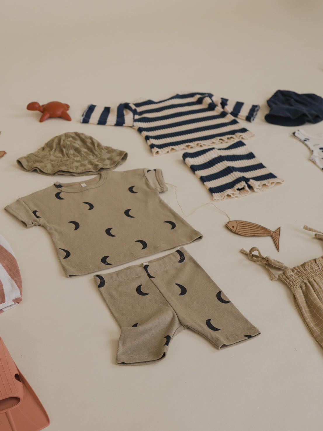 flatlay outfit matching dusky beige ribbed cotton boxy t-shirt & shorts with black moon print