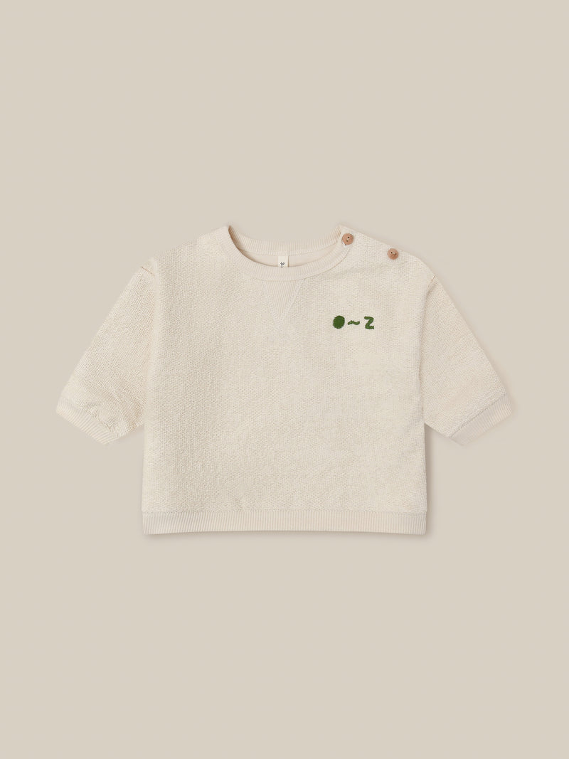 baby cream undyed cotton sweatshirt with O ~ Z embroidered in green with buttons on shoulder