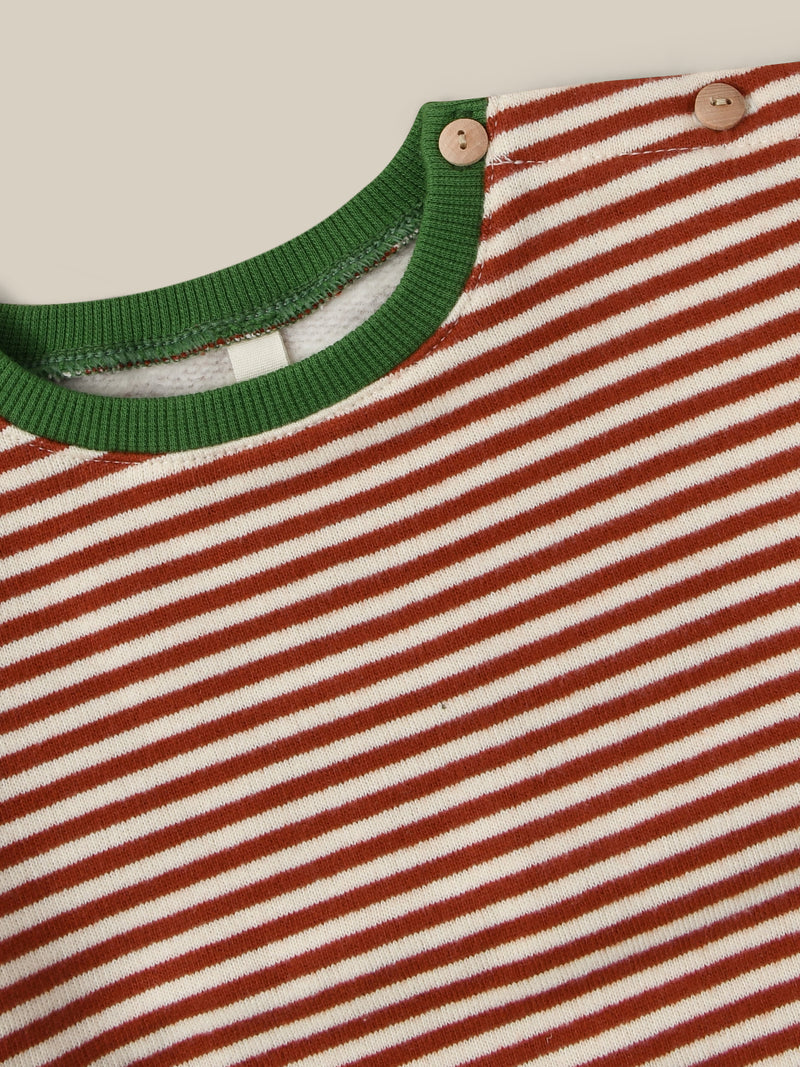 close up of christmas red stripes brushed cotton sweatshirt with green trims & buttons on shoulder