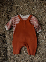 baby red waffle cotton salopettes & red & white stripes sweatshirt on farm straw