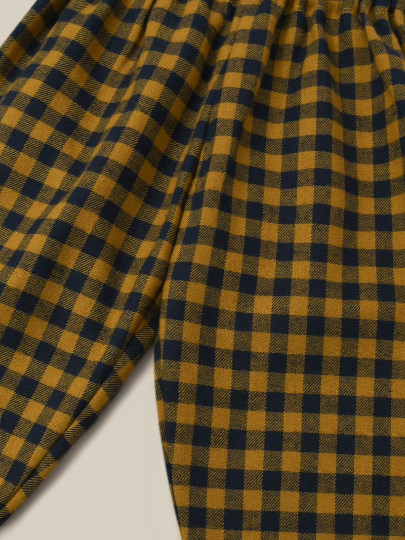 close up of checkered gingham wide leg flannel pants in navy and yellow