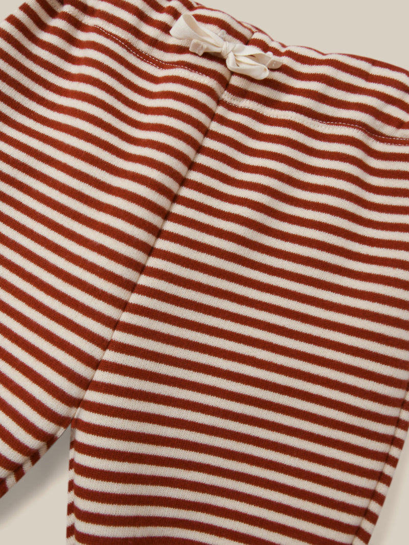 close up of terry cotton drawstring sweatpants in red and white stripes 