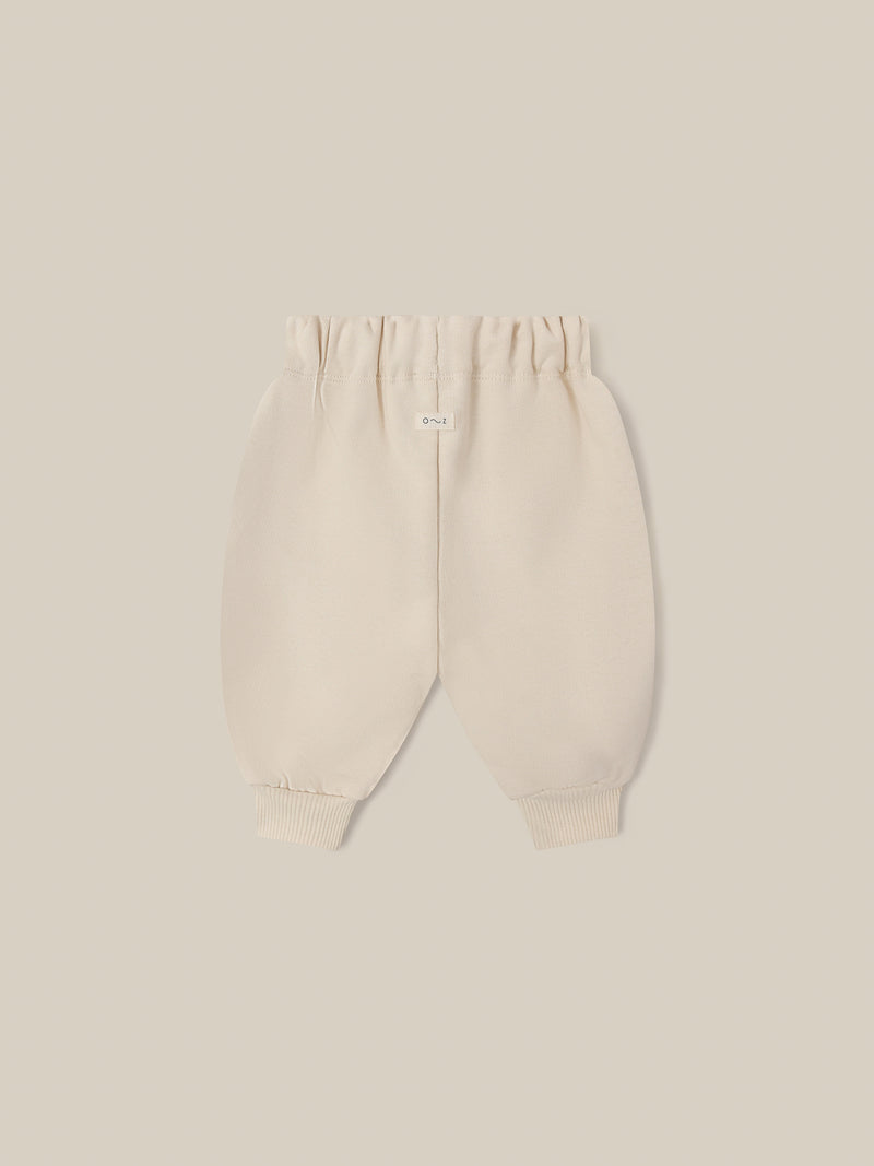 baby and toddler undyed cotton drawstring sweatpants in cream with O ~ Z embroidered in green