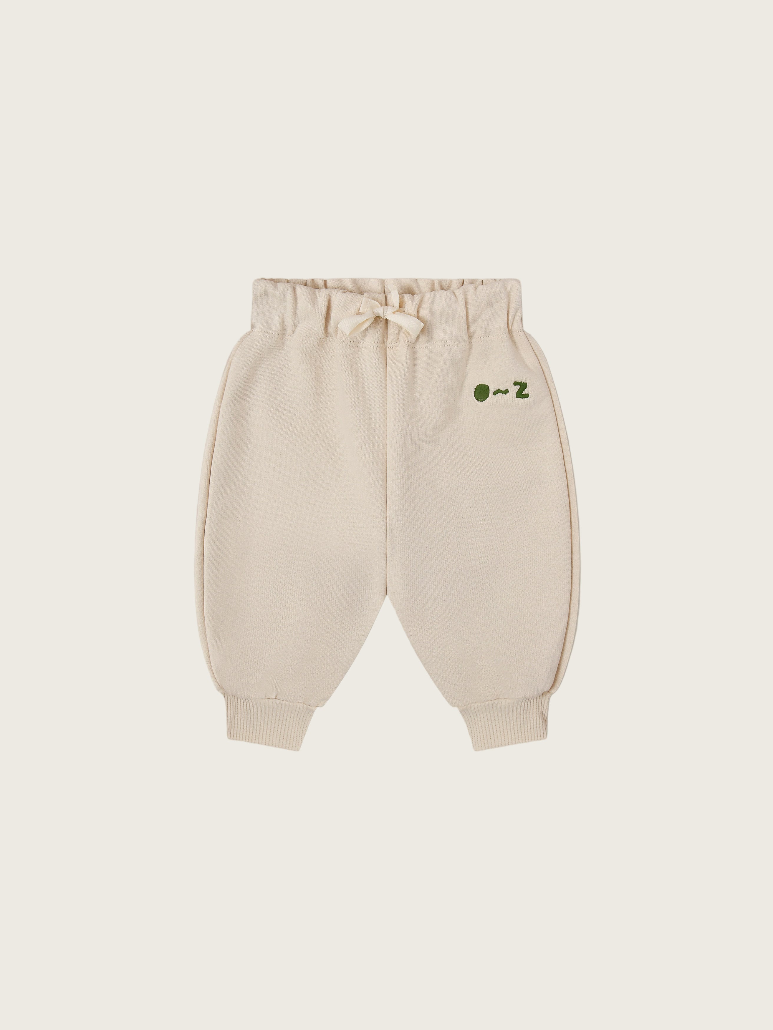 baby and toddler undyed cotton drawstring sweatpants in cream with O ~ Z embroidered in green
