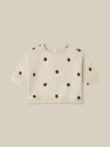 baby undyed cotton sweatshirt in cream with brown dots and two buttons on left shoulder