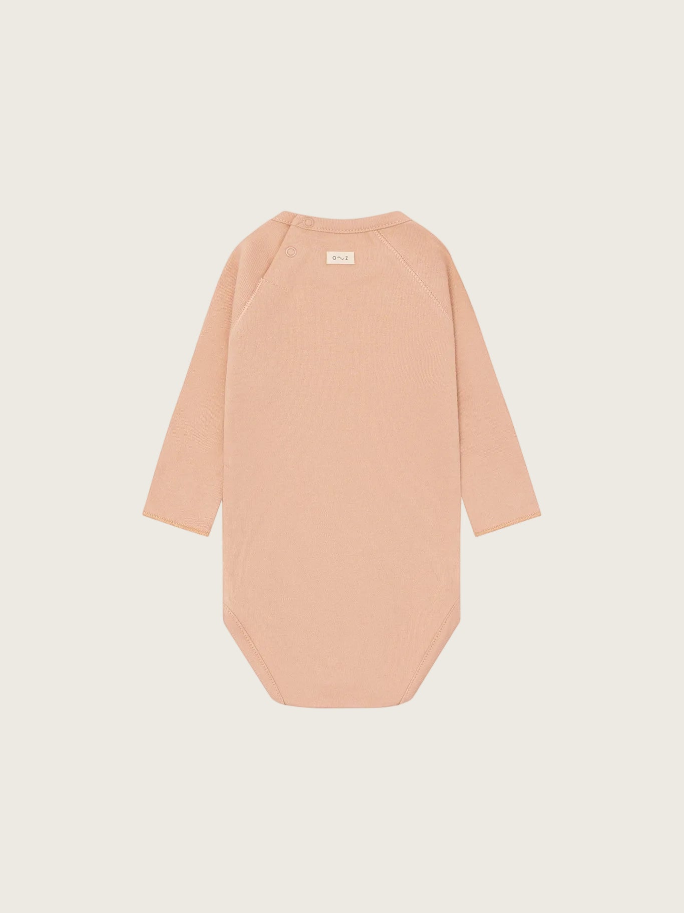 Beige bodysuit with long sleeves on a white background