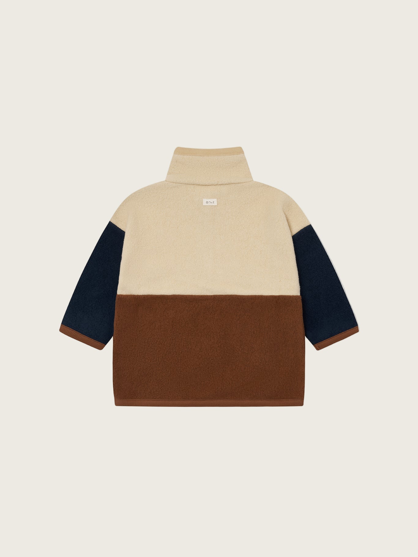 toddler organic fleece colour block cream sweater with brown and navy details, and front poppers