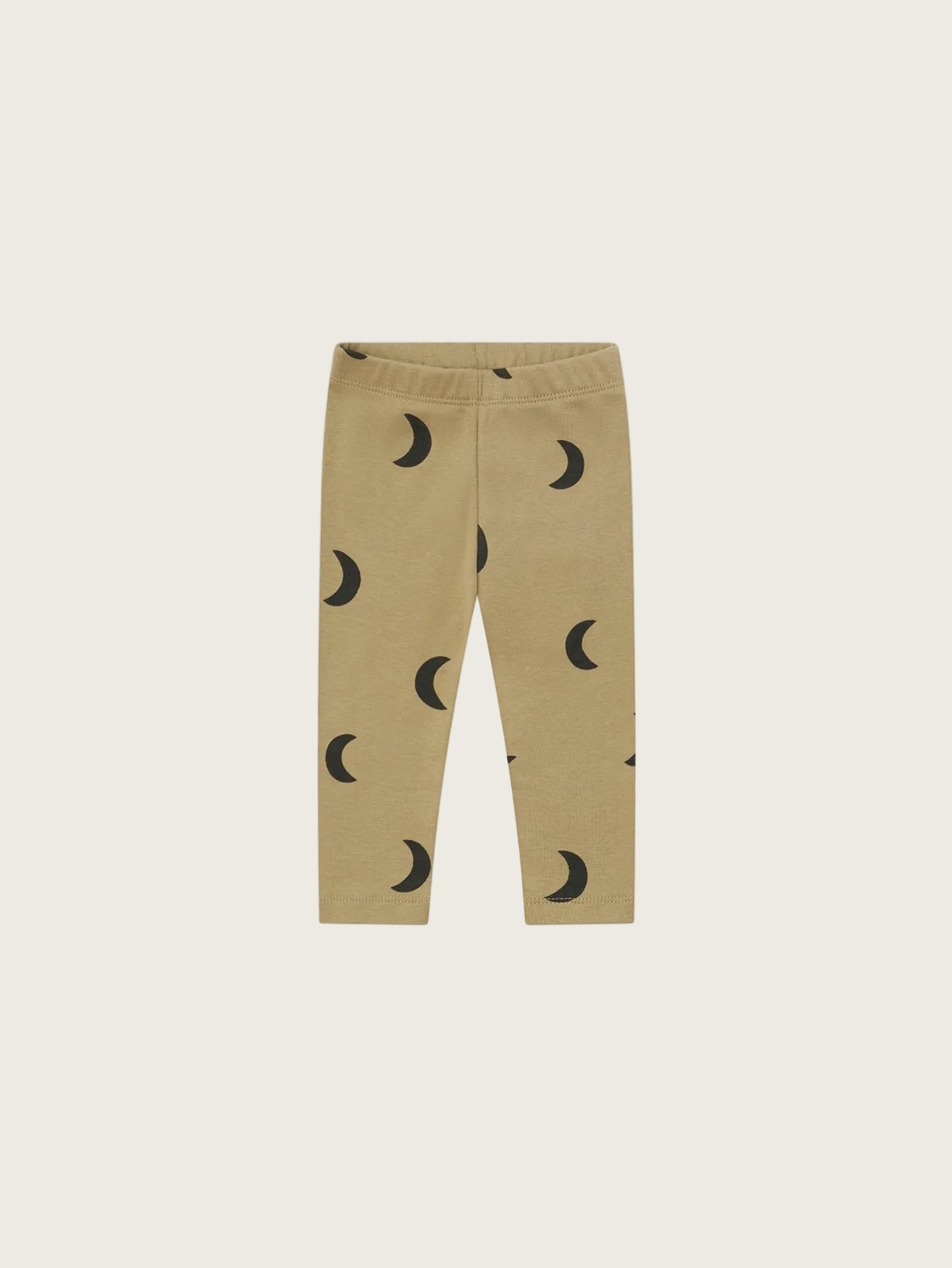 Beige leggings with a black crescent moon pattern, displayed flat against a solid white background.
