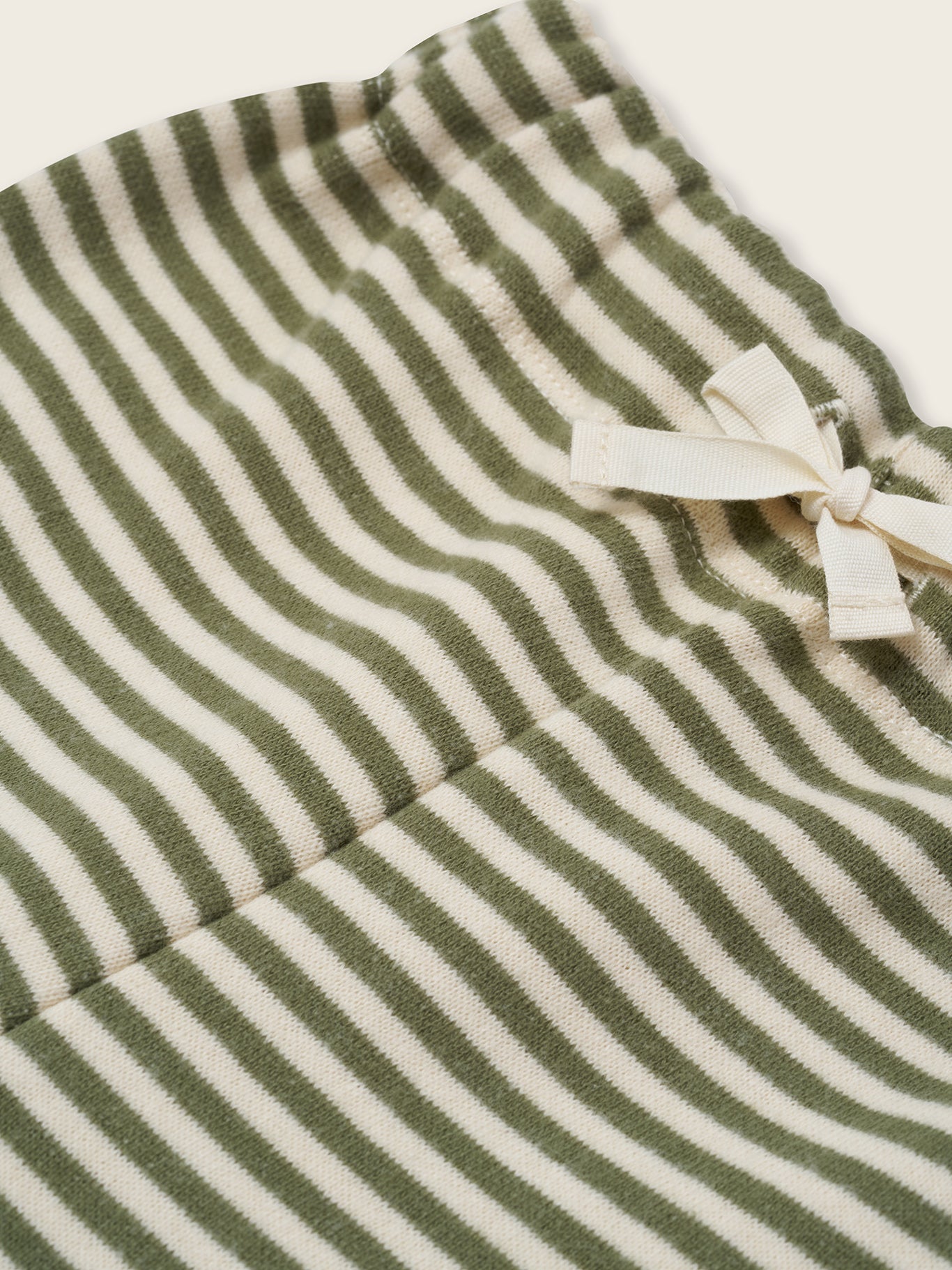 close up of organic terry cotton drawstring sweatpants in fern green and white stripes