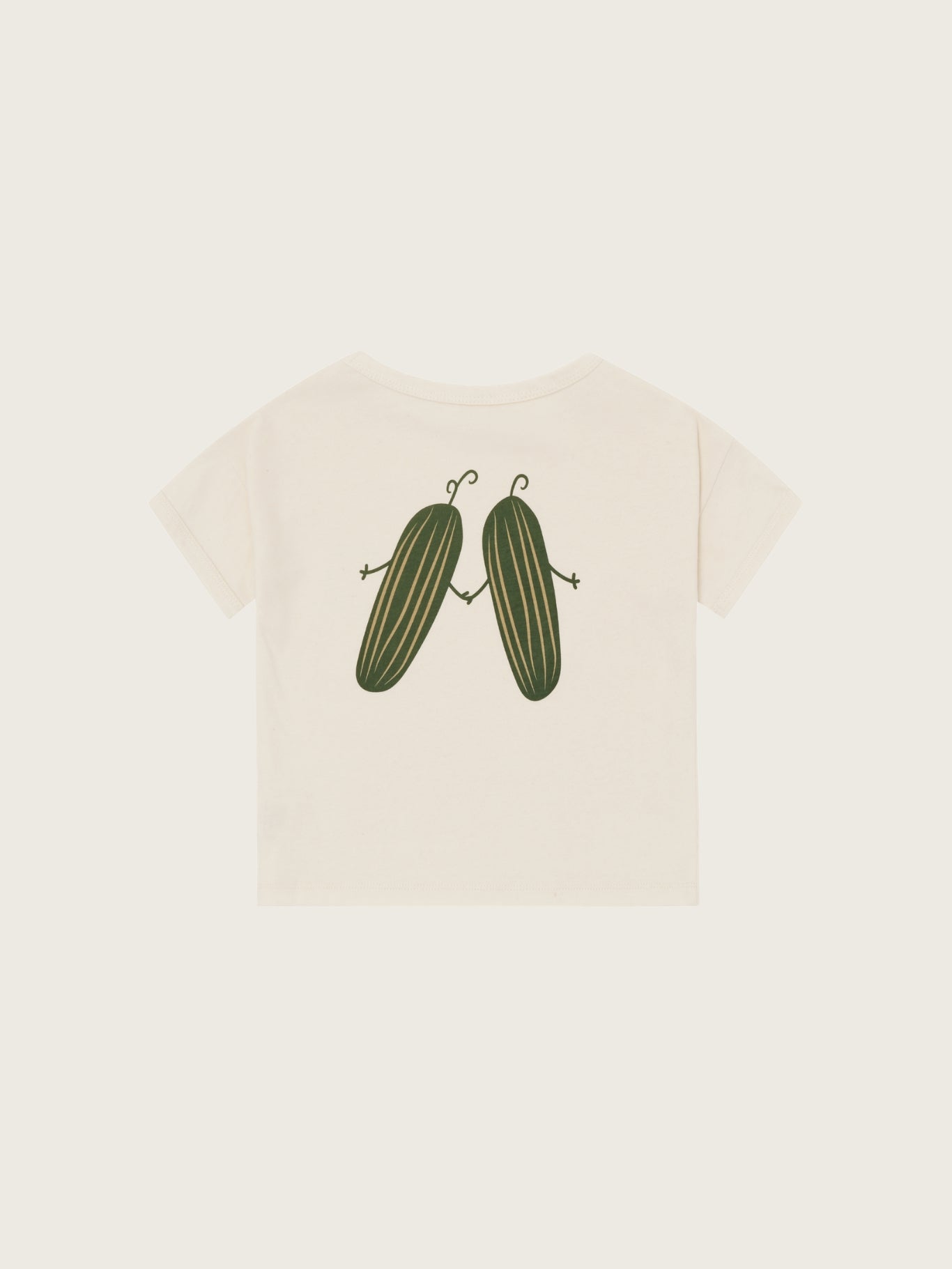 Beige t-shirt with cucumber graphic on a white background