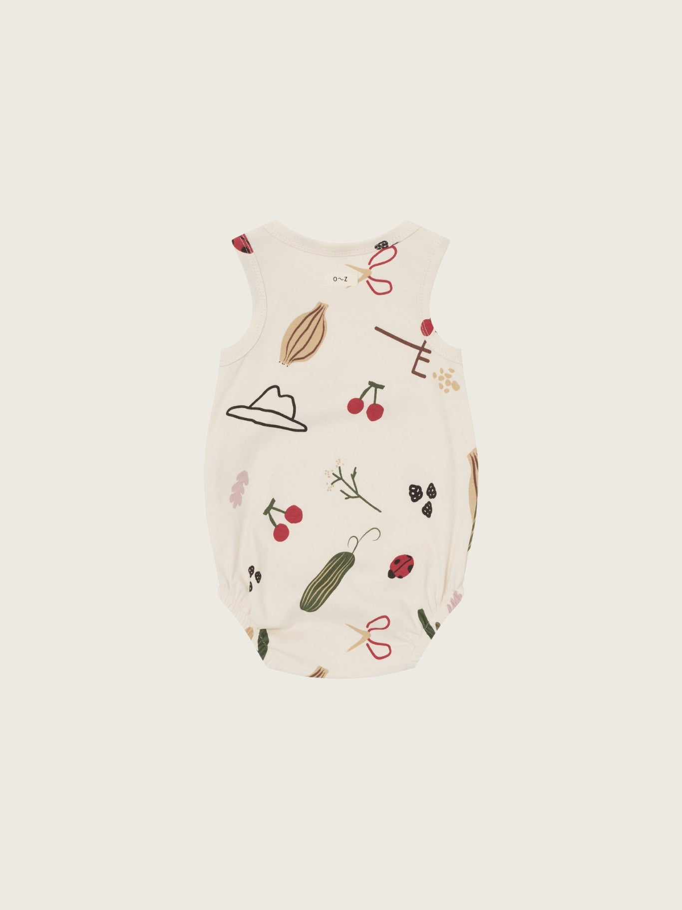 Baby bodysuit with nature-themed print on a white background