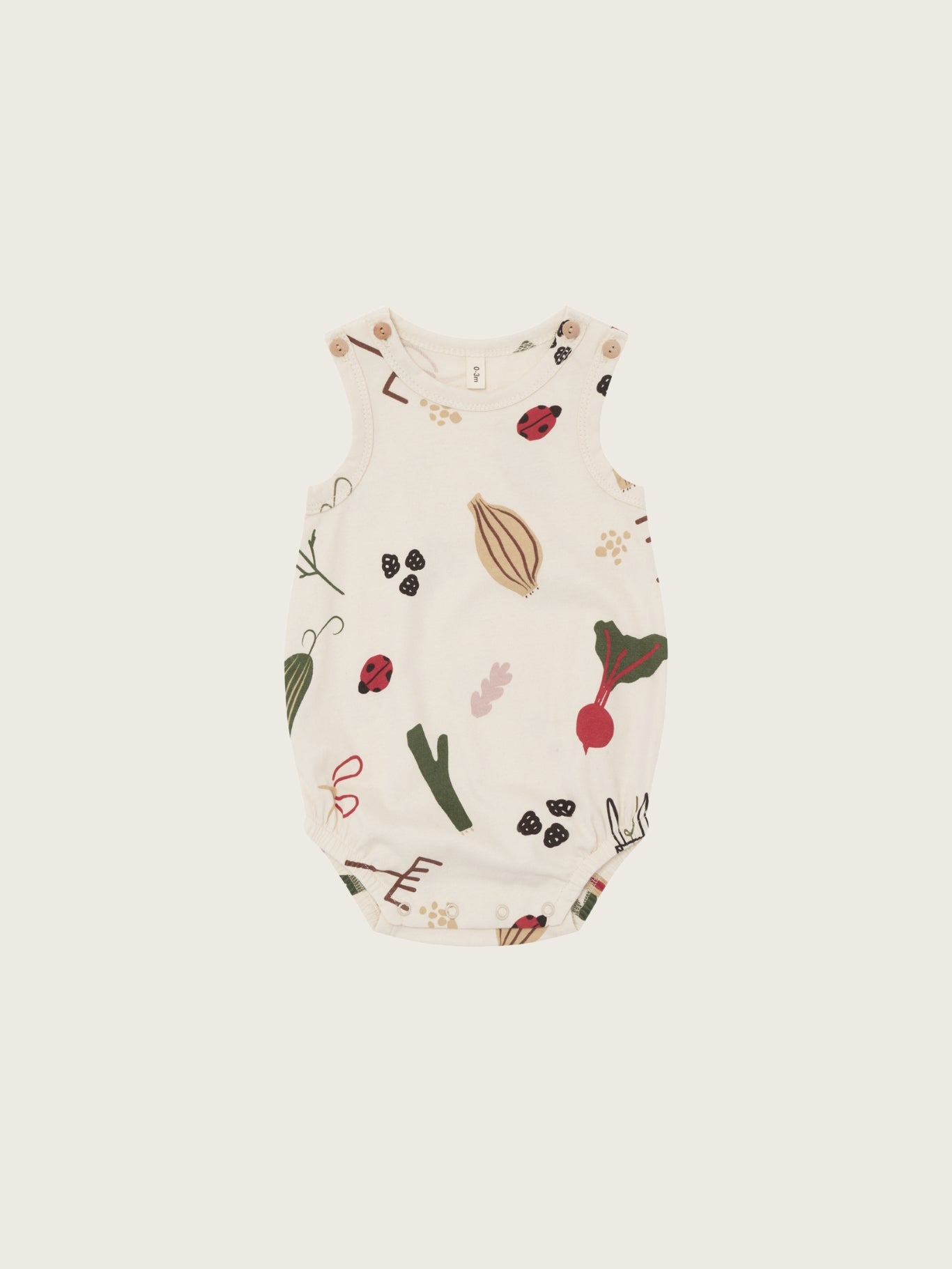 Baby bodysuit with vegetable pattern on a white background