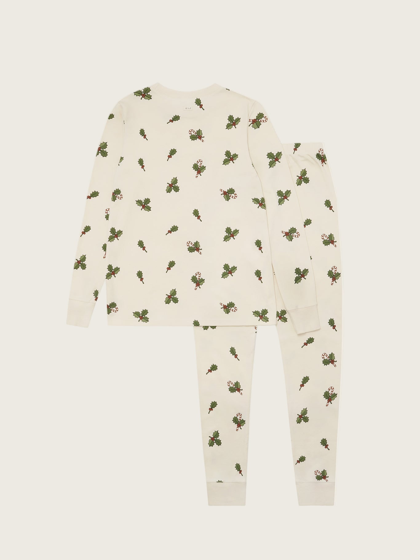Children's onesie with holly berry pattern on a white background