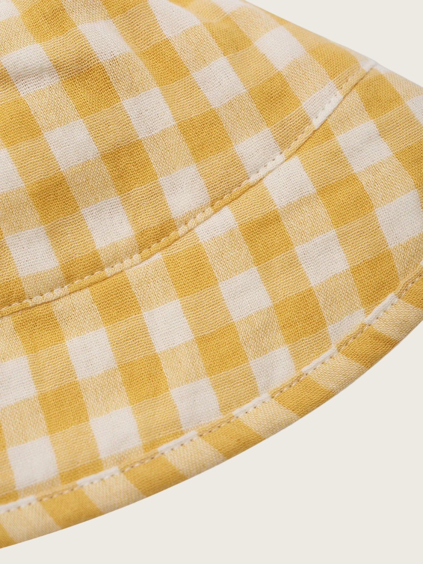 Close-up of a yellow and white checkered fabric texture