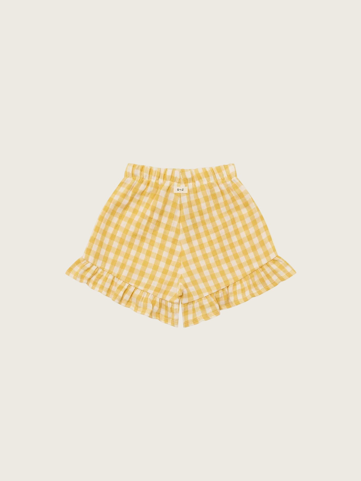 Yellow checkered shorts on a white background