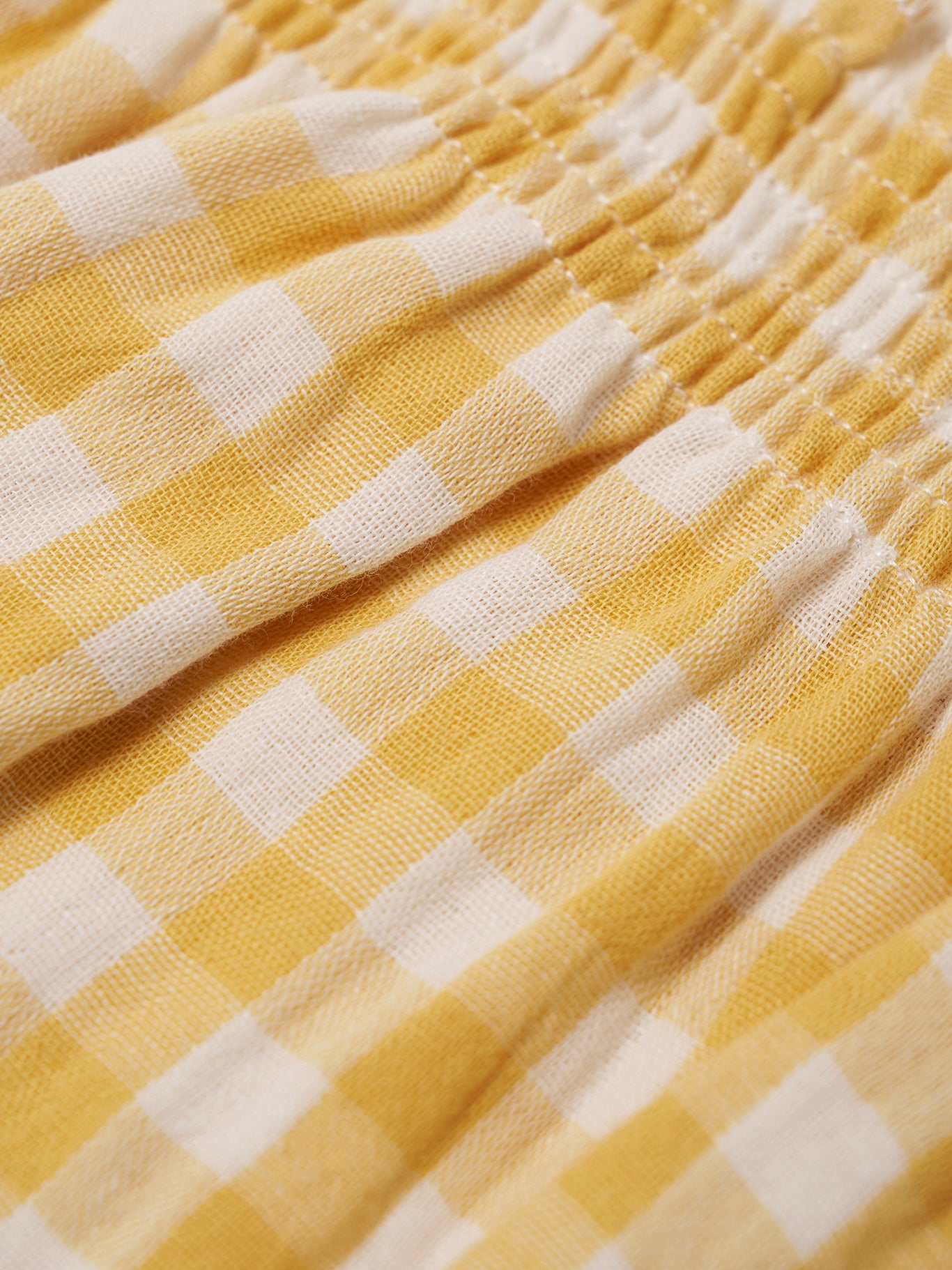 Close-up of yellow and white checkered fabric