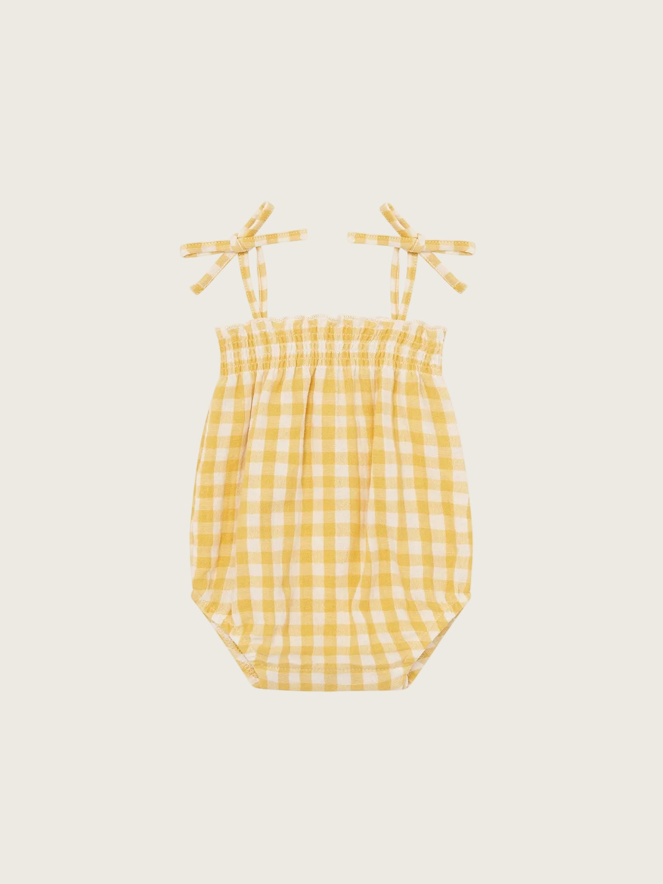 Yellow checkered baby bodysuit with bow straps on a white background