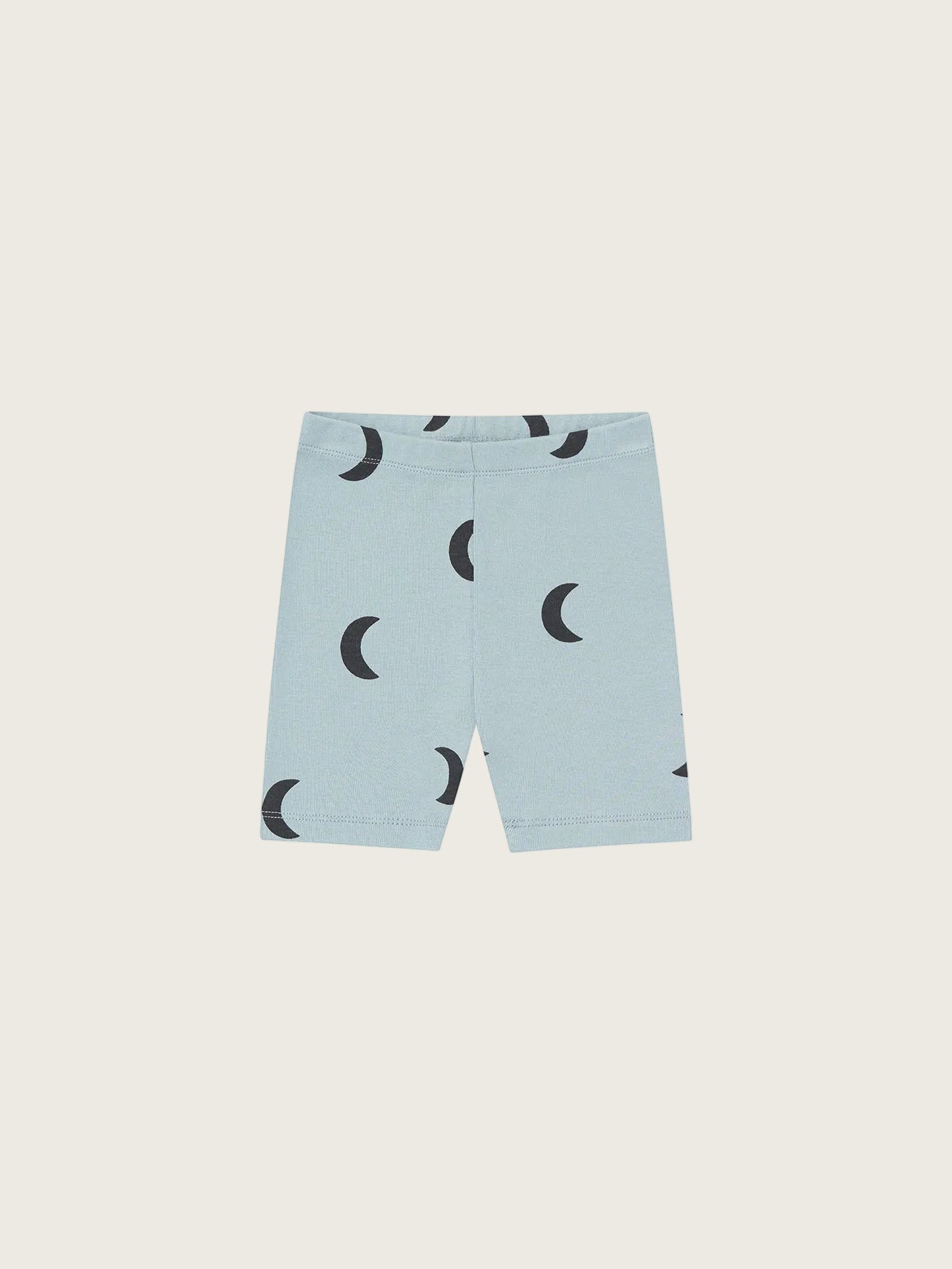 Light blue shorts with black moon pattern on a white background