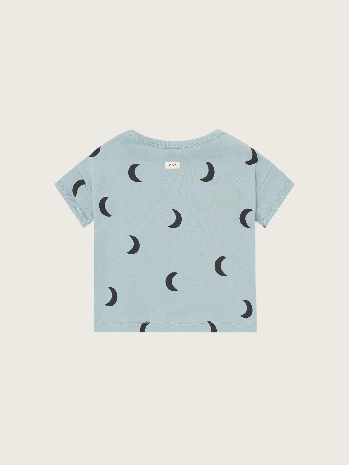 Light blue t-shirt with black moon pattern on a white background
