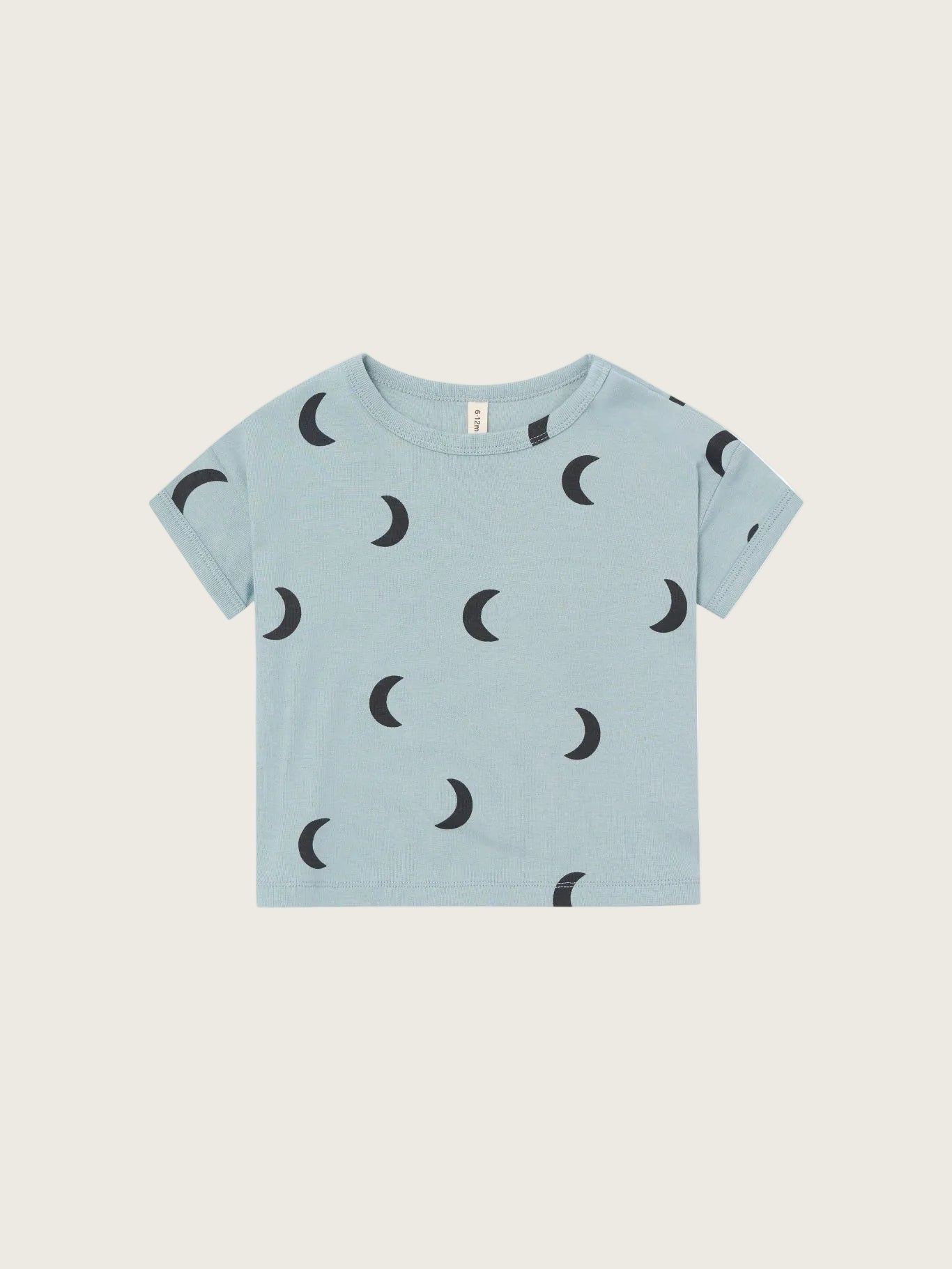 Light blue t-shirt with black moon patterns on a white background